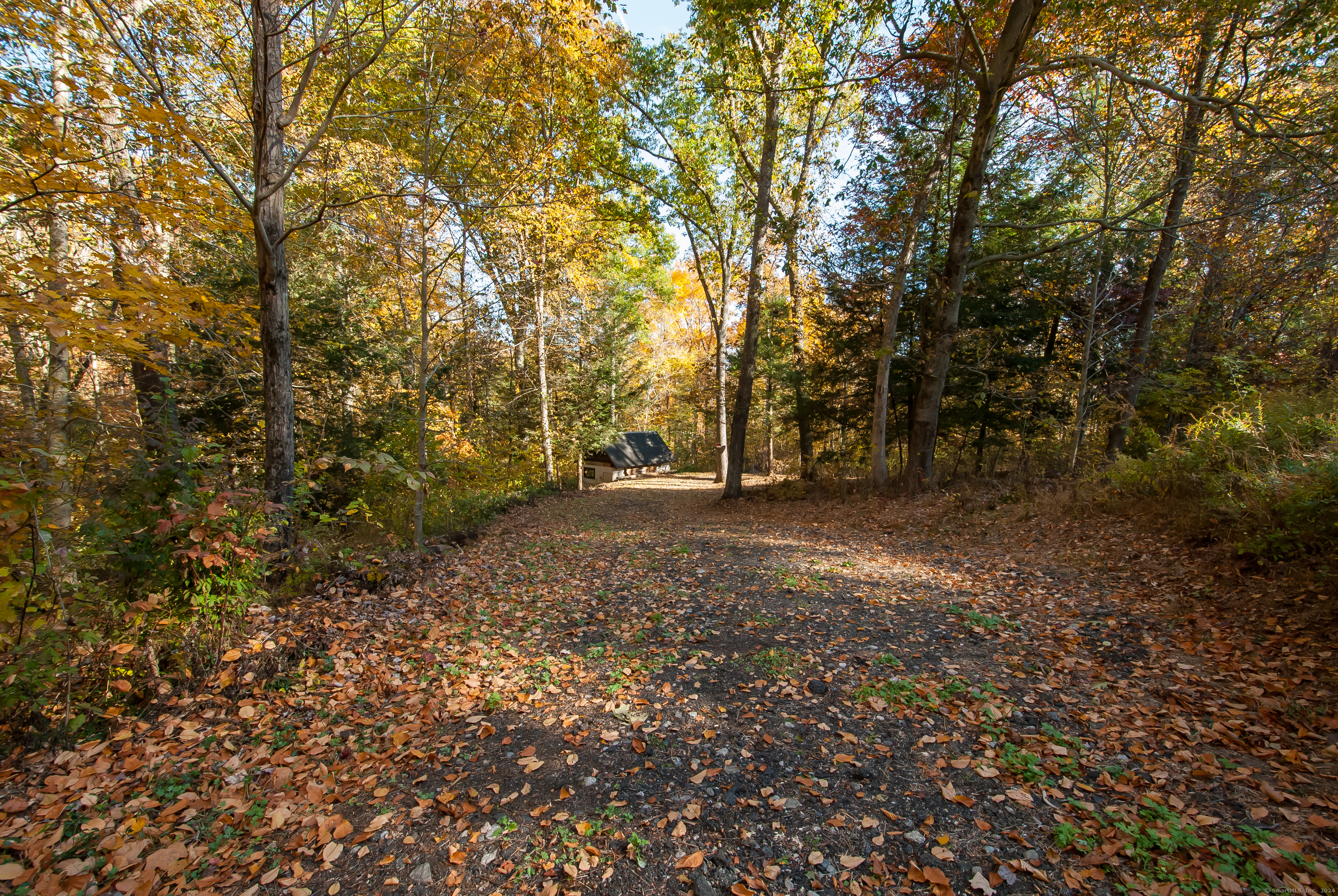 Nestled in the hills of Southbury, Connecticut, this unique and tranquil property is waiting to be embraced. It has breathtaking year-round views that can be incorporated into your future home design, allowing for sun-filled living spaces and stunning sunsets. The location is extraordinary, with easy access to numerous amenities. You are less than a 5-minute drive to the Pomperaug River, Housatonic River, Southbury Beach, and Lake Zoar, perfect for summer activities like swimming, boating, and lounging. Additionally, you are only 10 minutes from Southbury or Newtown centers, making this property an ideal spot for shopping and commuting. The lot has already seen the beginnings of improvements. A versatile shed is on-site, connected to both the septic system and the well. An electrical hookup can also be re-installed to bring in power. We have maps available for a proposed home site that will blend seamlessly with the natural surroundings-imagine the possibilities! For more information, we have attached a wonderful fall walk-around video of the lot. Feel free to reach out for additional details.