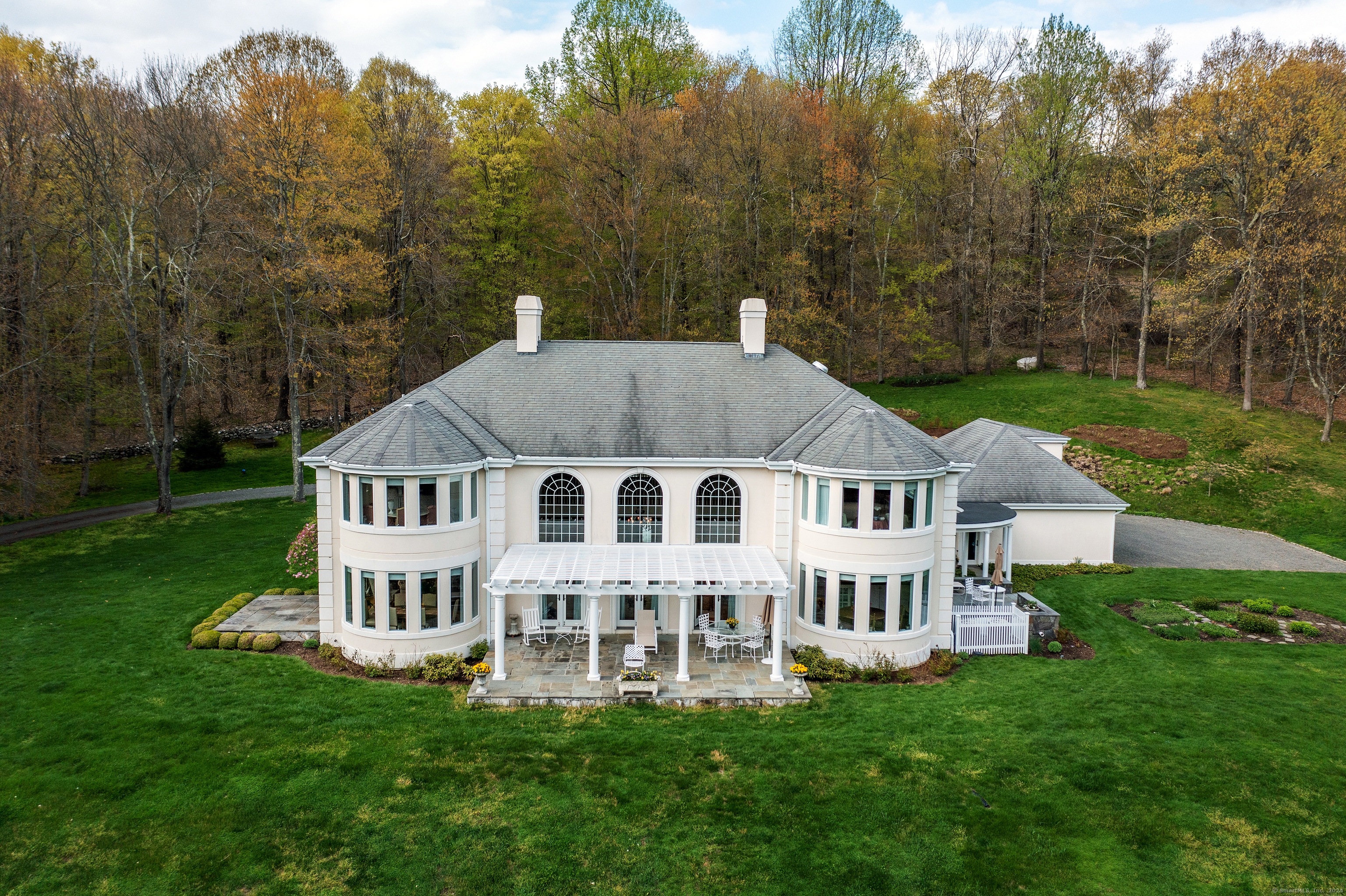 A Meandering Private Driveway Over a Small Brook Leads to this Very Private Stucco-Clad Colonial Set on 10+ Acres. Splash Around in the Pool with Separate Cabana. 4 Bedrooms, 3.5 Baths Including Main Level Bedroom & Bath. Large Eat In Kitchen with Dining Area & Tons of Counter Space. Dramatic Great Room with Fireplace & Sweeping Staircase. Generous Primary Bedroom Suite with Full Bath, Ample Closeting & Sitting area. Oversize 3-Car Garage Attached via Breezeway. Excellent Location Near Roxbury, Woodbury & Washington CT.