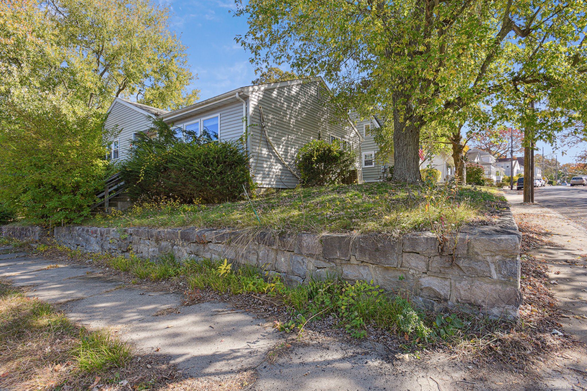 This spacious ranch features an updated kitchen, complete with granite countertops and modern appliances. You'll love the additional space in the finished basement, which includes a full bathroom, making it ideal for guests and movie nights. With a newer roof, solar panels and mini splits, this home offers impressive energy efficiency.  The large garage provides ample storage or workspace for your projects. Conveniently located near the US Coast Guard base, New London Submarine base, shopping and highways, this home is a fantastic opportunity! A little landscaping and TLC will go a long way. Don't miss out on making it your own!