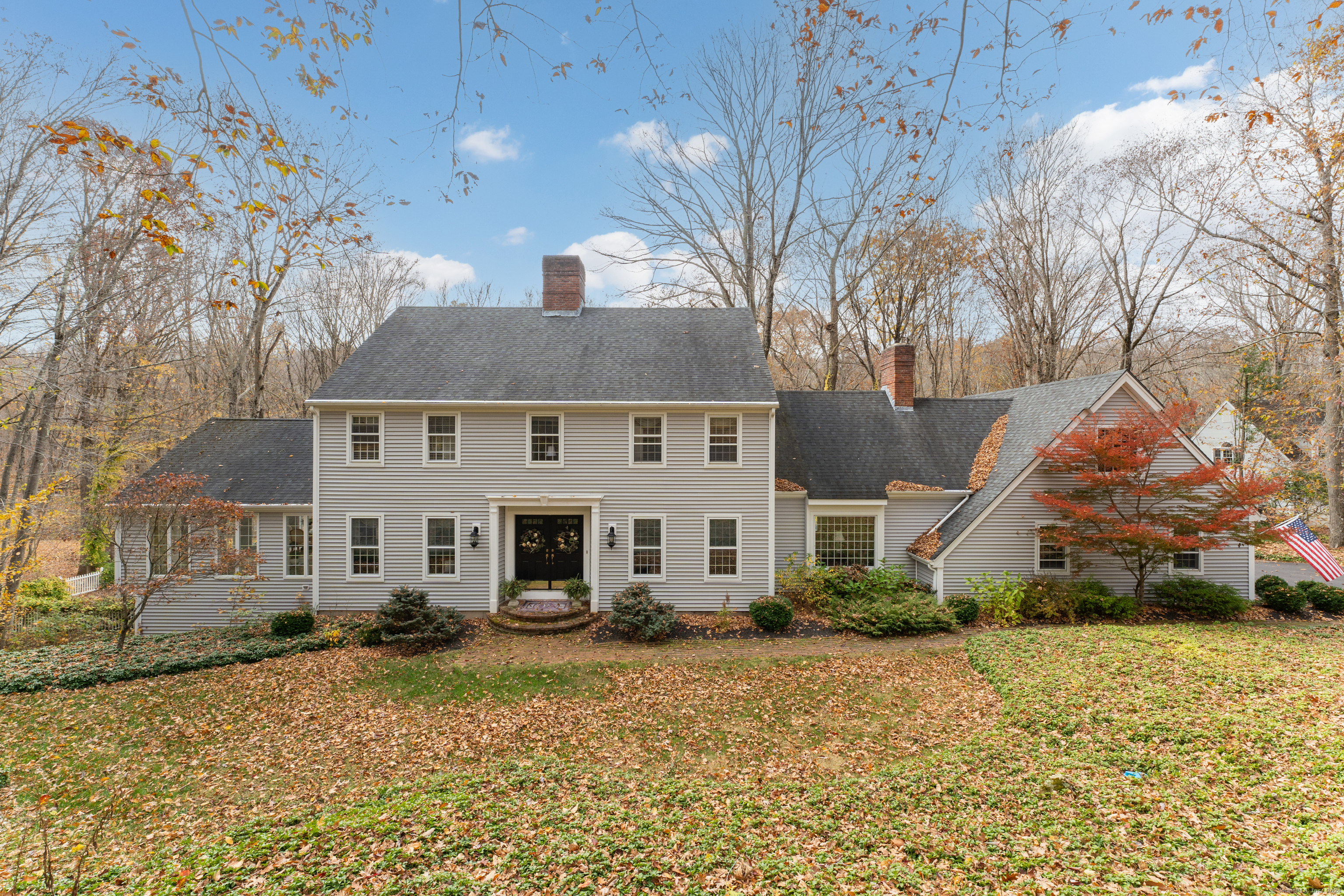 EMBRACE TIMELESS ELEGANCE IN THIS 4 BEDROOM / 2.5 BATH COLONIAL! Nestled on a lush 1.25-acre expanse in the Heatherwood section of Madison, this stately 4-bedroom, 2.5-bath Colonial home offers a harmonious blend of classic charm and modern comfort. Spanning over 3, 075 square feet of refined living space, this residence is a testament to enduring quality and thoughtful design. As you step inside, the design offers both grand entertaining and intimate gatherings. The home's heart is its elegant living areas, several with cozy fireplaces (one gas, two are wood), creating an ambiance of comfort and sophistication. The sun filled Great Room has a vaulted ceiling, wet bar and access to the outdoors.  The chef's kitchen, with granite counters and cherry cabinetry, was designed with functionality in mind, opening to a casual dining area, or for more formal occasions, the separate dining room awaits, ready to host your memorable feasts. Upstairs, the primary suite, boasts an en-suite bath, walk in closet and private Den (with fireplace) ensuring a private and restful end to each day. Three other bedrooms, and hallway full bath, provide plenty of room for guests, family and friends.  Outside, the property's multiple decks provide vantage points for admiring the picturesque inground pool. Bonus features include: New furnace, new AC, newer vinyl siding, roof = 2014, 3 zone oil heat, unfinished walkout basement (great storage!), hardwood floors! COME SEE!