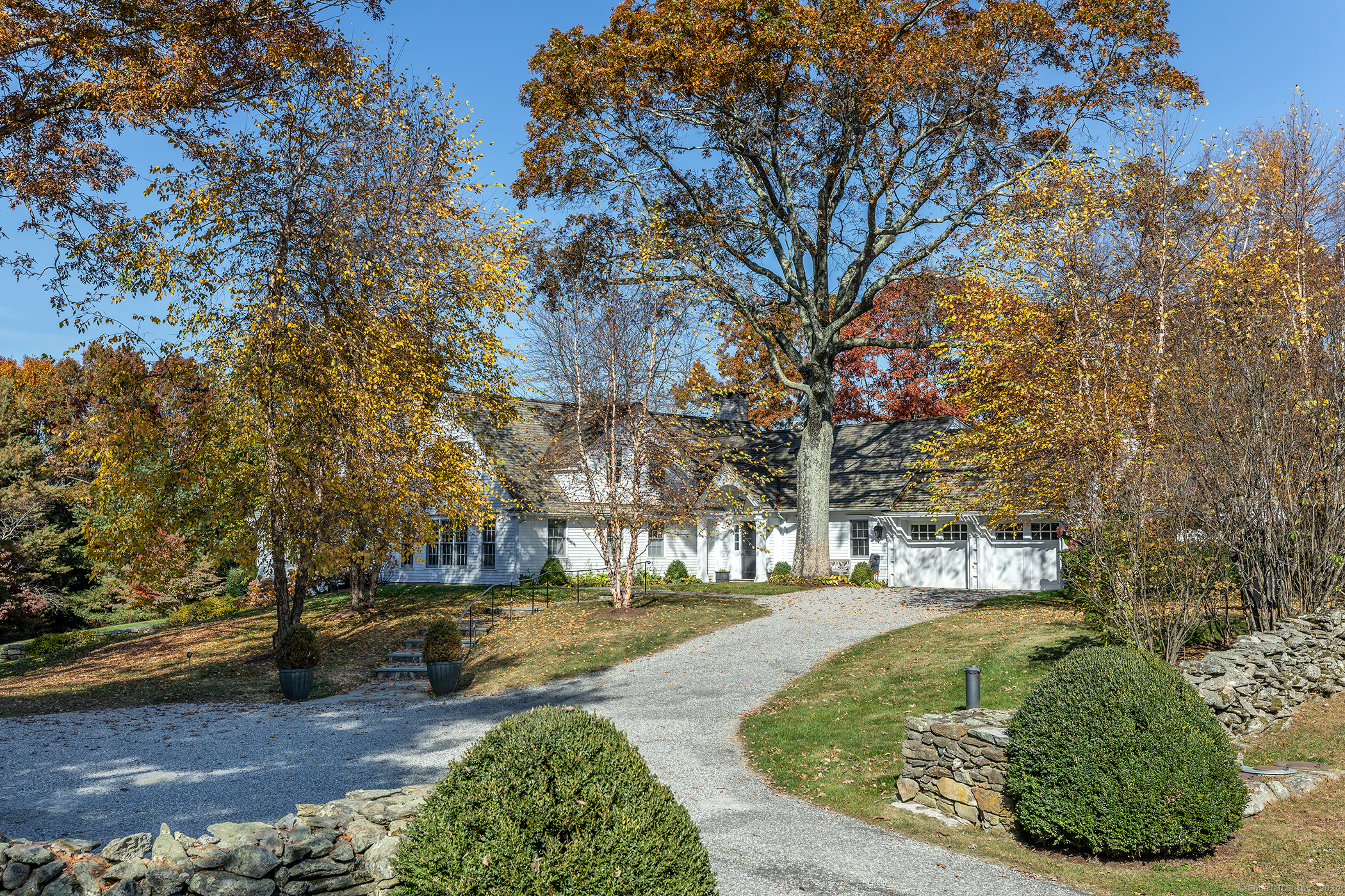 Tucked Down a Long Private Driveway Less than 1-Min to the Village is this Chic Renovated Colonial with Heated Pool. This Elegant 4+ Bedroom, 6.5 Bath Home Is Very Finely Detailed. Sophisticated Floor-plan Features 2 Main Level Bedrooms including Luxurious Primary Suite with 2 Full Baths, Large Walk-in Closets & a Fireplace. 3 Other en-Suite Bedrooms. Large Country Kitchen with Vaulted Ceiling & Fireplace. Come Nestle by the Fire in the Inviting Library. Dramatic Formal Living Room with Vaulted Ceiling & Fireplace. Separate Dining Room Wrapped in Glass. Convenient In-House 2-Car Garage. Easy Access to Roxbury Village & Town Tennis Courts. Less than 12 Min to Washington, Woodbury, New Milford & Southbury. 1.5 Hours NYC. A Very Chic Country Retreat.