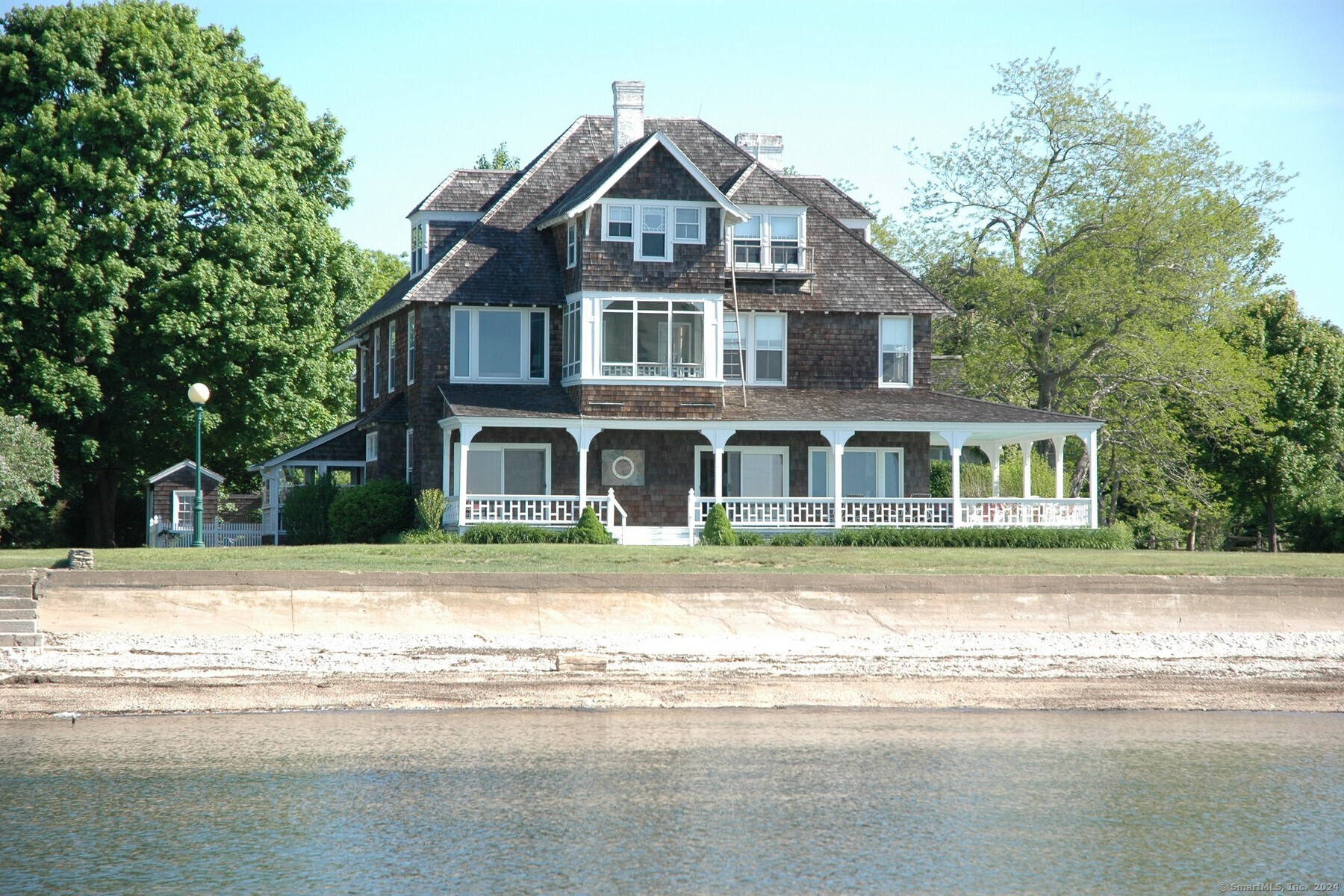 Embrace the Quintessence of Summer Living at the Historic Fenwick Cottage ~ Nestled in the heart of the Borough of Fenwick, this iconic Victorian waterfront cottage presents a rare opportunity to experience summer as it was meant to be. With its shingled exterior and timeless charm, the Fenwick Cottage is an idyllic retreat for the discerning summer resident. This shingled historic cottage boasts an open floor plan complemented by high ceilings and original architectural elements, creating an atmosphere of elegance and comfort. Each room in this storied residence has panoramic vistas, ensuring that the serene beauty of the shoreline is always within sight. Fenwick Cottage is a haven for everyone, with access to golf, tennis, pristine beach and boating - all the ingredients for an unforgettable summer. Available for a one or two-month rental during the peak of summer - July and/or August