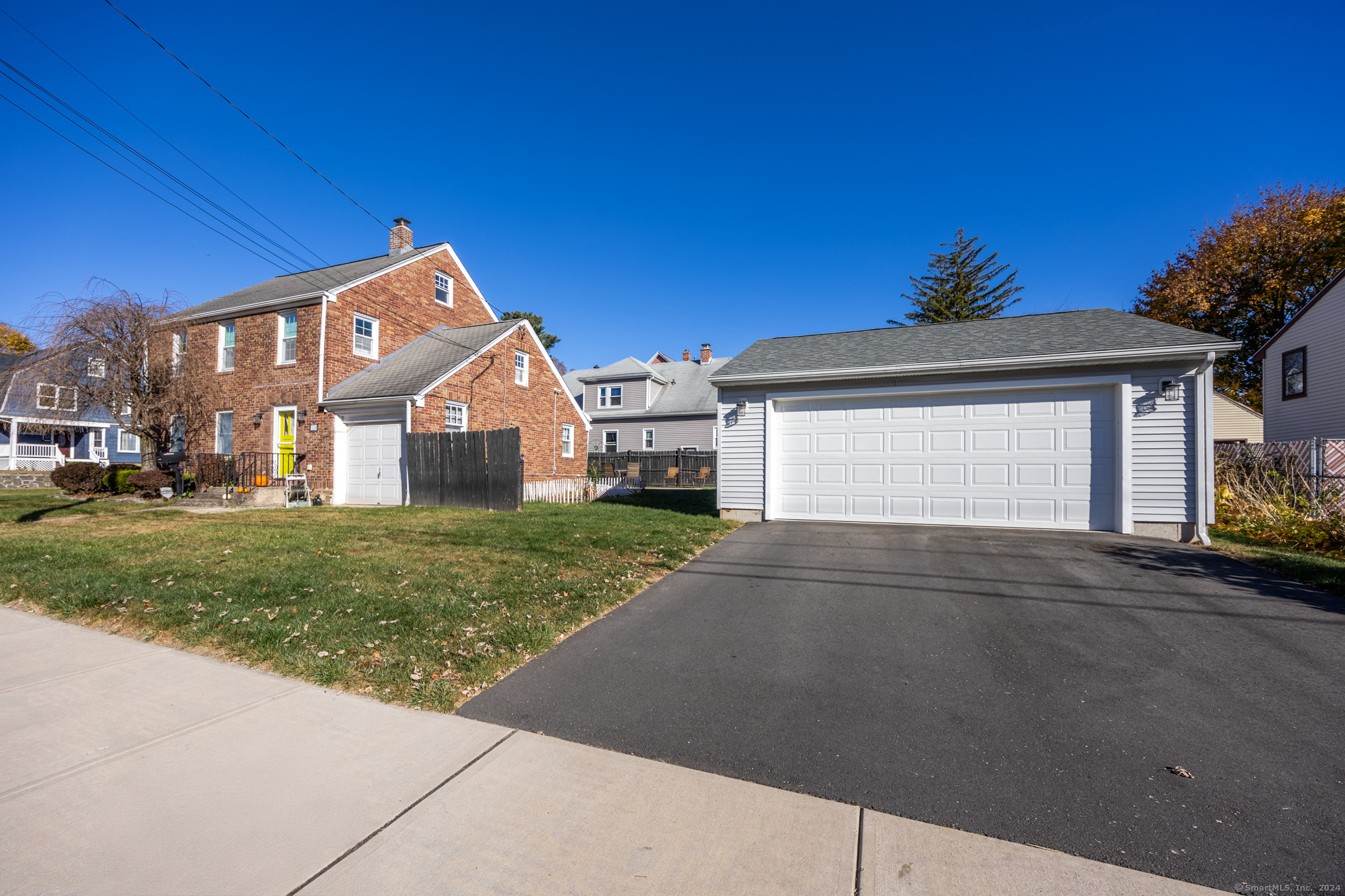 Located in a desirable neighborhood within New Britain near parks, schools, shopping, restaurants, public transportation, and within walking distance to CCSU. Enjoy the classic kitchen with original oversized farm style double sink, living room with incredible natural light, & dining room with a built in hutch. The sunroom gives you the extra space you will love, right off of the living room. Laundry is located on the main floor. The 2nd floor hosts your 3 bedrooms, a spacious walk in closet, and full bathroom. The third floor is a partially finished walkup attic that was once used as the primary bedroom. With exterior features including a large oversized recently installed patio and fenced in yard this home has the outdoor space to entertain friends and family, unlike others in the neighborhood. New sidewalks have been installed, the driveway is in perfect shape, and recently a detached 2 car garage was installed. Plant a garden, host a bonfire, walk to the park, or play yard games, the possibilities are endless. This property won't last!