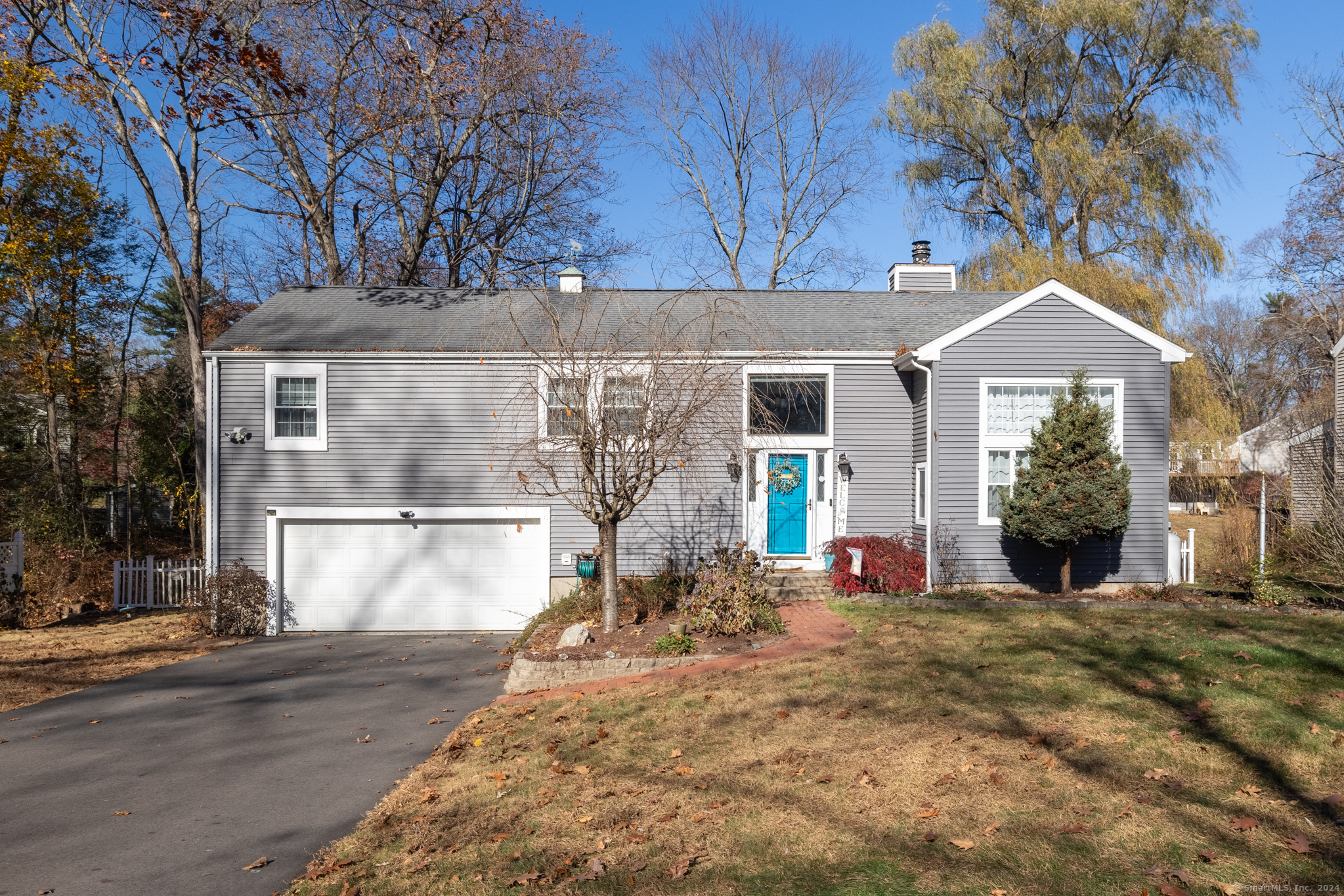 Welcome to 29 Towhee Ln, a stunning residence in the heart of Glastonbury! This spacious home boasts four bedrooms and four full bathrooms, as well as a lower level in-law setup making it ideal for families of all sizes. Enter through the front door into the foyer and living room area with large windows and stunning fireplace. Up a few steps into the main level, you'll find a gorgeous kitchen with oak cabinetry, granite countertops, tiled backsplash, and updated appliances. Dining and kitchen area overlook the beautiful living room! All three full bathrooms on the main level have been updated, popcorn has been removed, and new flooring has been installed! Retreat to your private sanctuary with a beautifully renovated master bath, featuring high-end fixtures and finishes. Family room with access to the deck and above ground swimming pool! The lower level offers a convenient in-law setup, with its own kitchen, split system heating, full bath, bedroom, and walk out sliding glass doors providing privacy and comfort for extended family or guests. The rest of the finished lower level consists of finished storage area and additional room that can be used as an extra bedroom with built in bunk beds! Designated laundry room keeps chores out of sight. This property is nestled in a desirable neighborhood, combining the tranquility of suburban living with easy access to local amenities, schools, and parks. Brand new propane furnace and central air system. Come make this one your own!