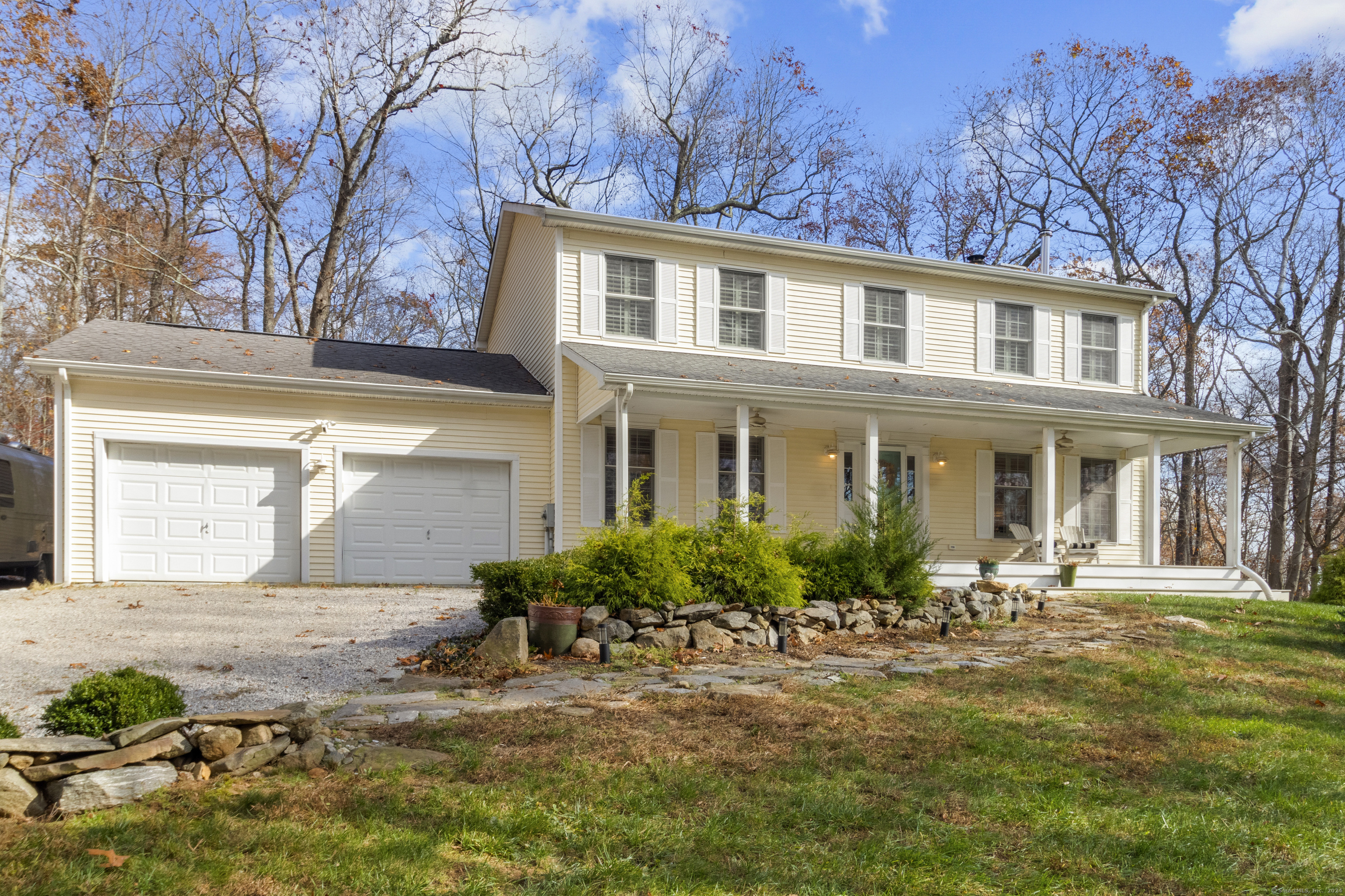 Introducing 27 Eagle Ridge Drive, a rare find located just moments from the vibrant heart of downtown Essex. This beautifully secluded 4-bedroom, 2 1/2-bathroom Colonial-style home sits on nearly an acre offering the perfect blend of tranquility and convenience that also provides access to Canfield- Meadow Woods Nature Preserve, 300 plus acres of open space and hiking trails. This home is an ideal sanctuary for those seeking comfort and style w/ sophistication. Upon entering you will be impressed by the bright airy space accentuated by wide- plank flooring, which adds to the timeless elegance that defines this home. The newly updated galley kitchen w/ brand-new stainless steel appliances, pristine granite countertops, and a breakfast bar/nook is perfect for casual dining or sipping your morning coffee. Herman Miller Nelson Bubble Lamps illuminate in the family room next to the wood burning fireplace that serves as a focal point. The formal dining room is perfect for holiday meals. Upstairs you will find the primary bedroom ensuite w/ ample closet space and a full bath. 3 additional well-sized bedrooms, perfect for a growing household, guests, or home office space. Another full bath is located conveniently down the hall. Full basement w/brand-new insulation, ready to be finished for additional living space- ideal for a media/game room or home gym. Relax on the front porch or host gatherings on the back deck! This house has all the trimmings to be home!