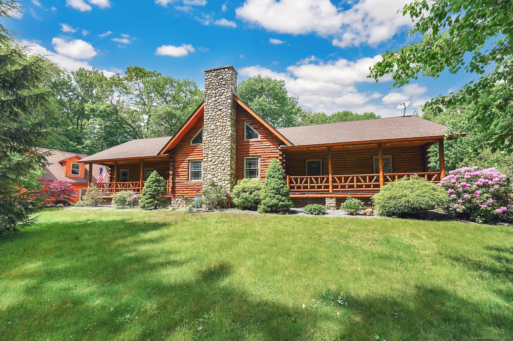 This Open Concept Custom Built Log Cabin Home features hand peeled logs and Cathedral Ceilings and has everything to offer to it's new home owners. This Home made the Front Page of the 2005 Country Best Log Homes and With it's unique style this home was personally designed by the owners in 2002 and sits on 5.65 acres of land. This home has a total of Three garages however the detached garage has a double bay as well as a heated work room with a large attic perfect for someone who has multiple cars and wants a small work shop. This beautiful home has an extraordinary Stone Fireplace and a total of 5 Bedrooms, 3 Full Baths, a Loft that opens up to it's own deck on the back, it also features a Private Office that can be entered from the interior of the home or private access through the garage. Kitchen features Granite Counter tops. Home has Hardwood & Ceramic Floors throughout. The Main Bedroom features three Closets, one which is a walk-in closet & the Bathroom in the main bedroom has Lime Stone Flooring with a Whirl Pool. Basement is finsihed with 10 ft foundation walls. Let's not forget the huge fenced in backyard that has a New above ground pool and extra shed. You won't find another home with these features and level of privacy like this yet close to all area amenities. Book your appointment today.