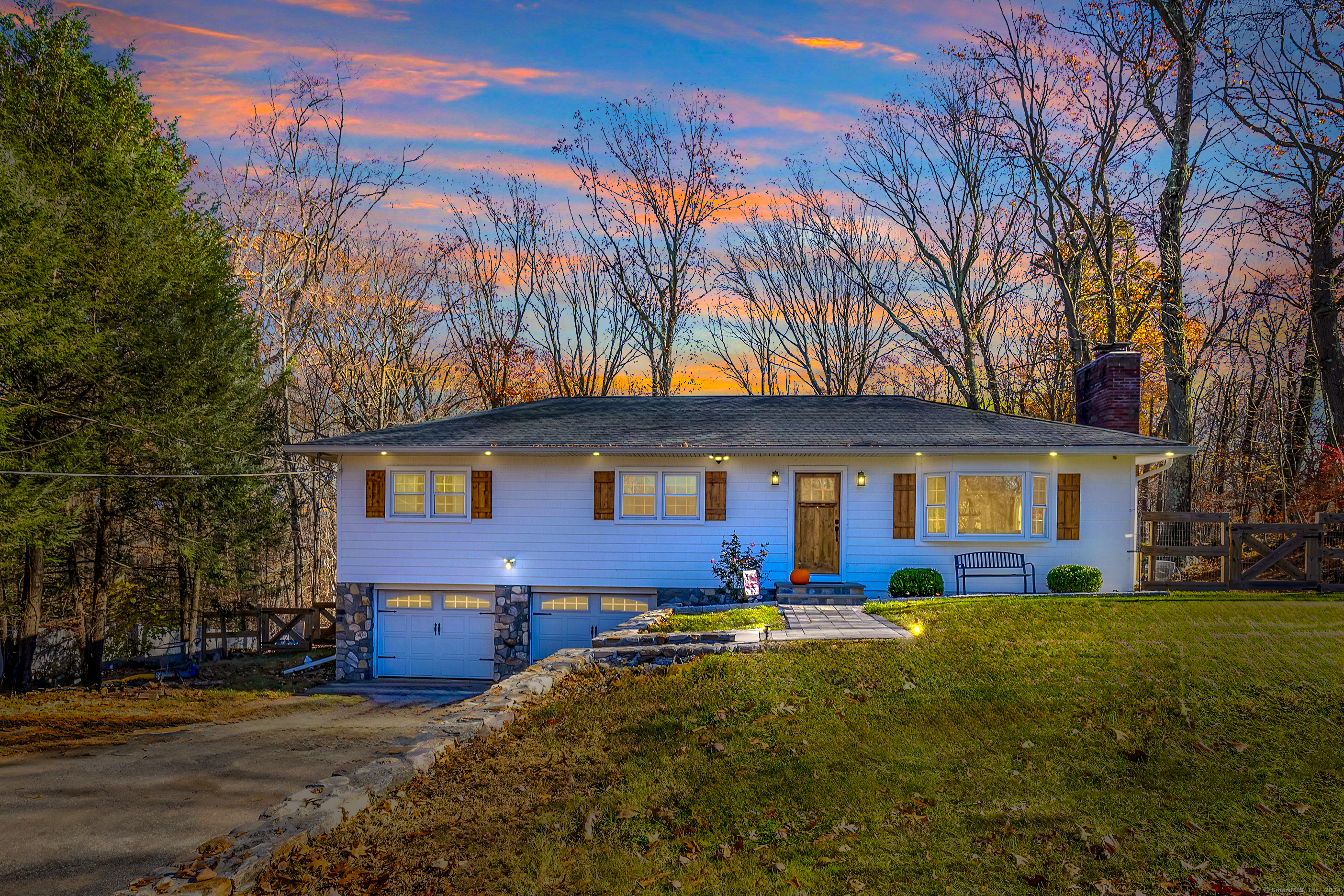 **Charming 3-Bedroom Ranch on 2.14 Acres - A Perfect Blend of Modern Comfort and Farmhouse Charm** Nestled on a peaceful 2.14-acre lot, this beautifully updated 3-bedroom ranch offers the perfect blend of contemporary style and farmhouse warmth. A stunning stone wall leads you to the front door, creating a welcoming entrance to your private retreat. Inside, gleaming hardwood floors flow throughout the main living spaces, creating a seamless transition between rooms. The spacious living room features a large bay window that floods the space with natural light, highlighting the cozy fireplace - the perfect spot to relax with family or entertain friends. The heart of the home is the updated kitchen, which opens directly into the dining area. This open-concept design makes the space ideal for both everyday living and entertaining. The kitchen boasts sleek quartz countertops, stainless steel appliances, a slide-in gas range, and a stylish stainless steel vent hood that completes the modern look. The dining room features a large picture window, bringing in beautiful views of the outdoors, while a man door provides easy access to the deck, making indoor-to-outdoor entertaining a breeze. The primary bedroom offers a peaceful retreat, complete with generous space and an en-suite bath featuring a large walk-in shower for ultimate relaxation. The lower level of the home is partially finished with stylish vinyl plank flooring and enhanced by recessed lighting and crown molding, addi