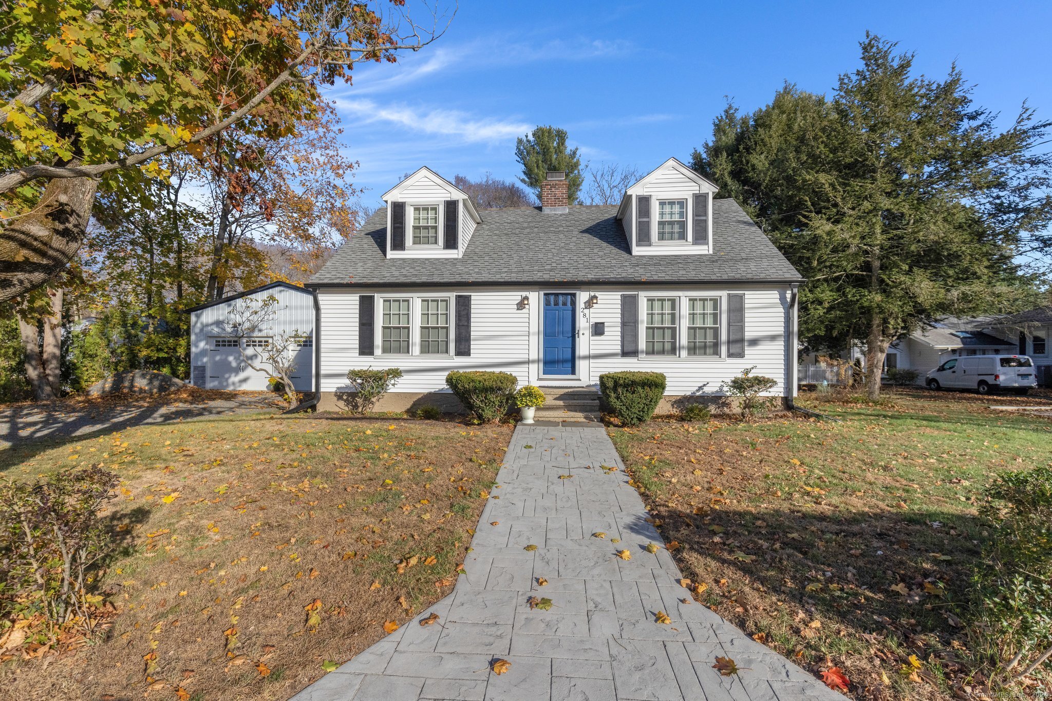 This beautifully renovated 2 bed, 2.5 bath, Cape-Cod style home offers not only classic charm, but modern efficiency with premium upgrades. The property boasts energy-efficient upgrades (new vinyl siding, windows, 96% efficient HVAC system, LED lighting). The kitchen is a chef's dream with silestone quartz counters all around - feat. GE Profile appliances, high end fixtures, and a center island. The main-floor includes a charming New England style sitting/living area with a fireplace, large dining area, huge living room, and main floor laundry for convenience. An added bonus; there are hardwood floors under the carpeted areas! Upstairs, the primary suite features an oversized closet with pocket doors and a luxurious clawfoot tub and stall shower. The 2nd bedroom includes a 3/4 bath. Outside is an entertainer's dream, with a stamped concrete patio, bluestone-capped fire pit, and 1, 500-gal koi pond, surrounded by mature trees, a flowering dogwood and crepe Myrtle, and arborvitae for privacy. Relax under the portico equipped with a ceiling fan, serving area, TV mount and beer taps. A spacious, 24x36 insulated 4 car garage has a pull-through bay, 100-amp panel, spray foam insulation, is prepped for a bathroom addition, and features a glass garage door that opens to the patio. Sitting just under a mile from Guilford Green, all connected by sidewalk, this property offers easy access to I-95 and is under 15 mins to New Haven and is minutes from beaches, dining, hiking, and golf.