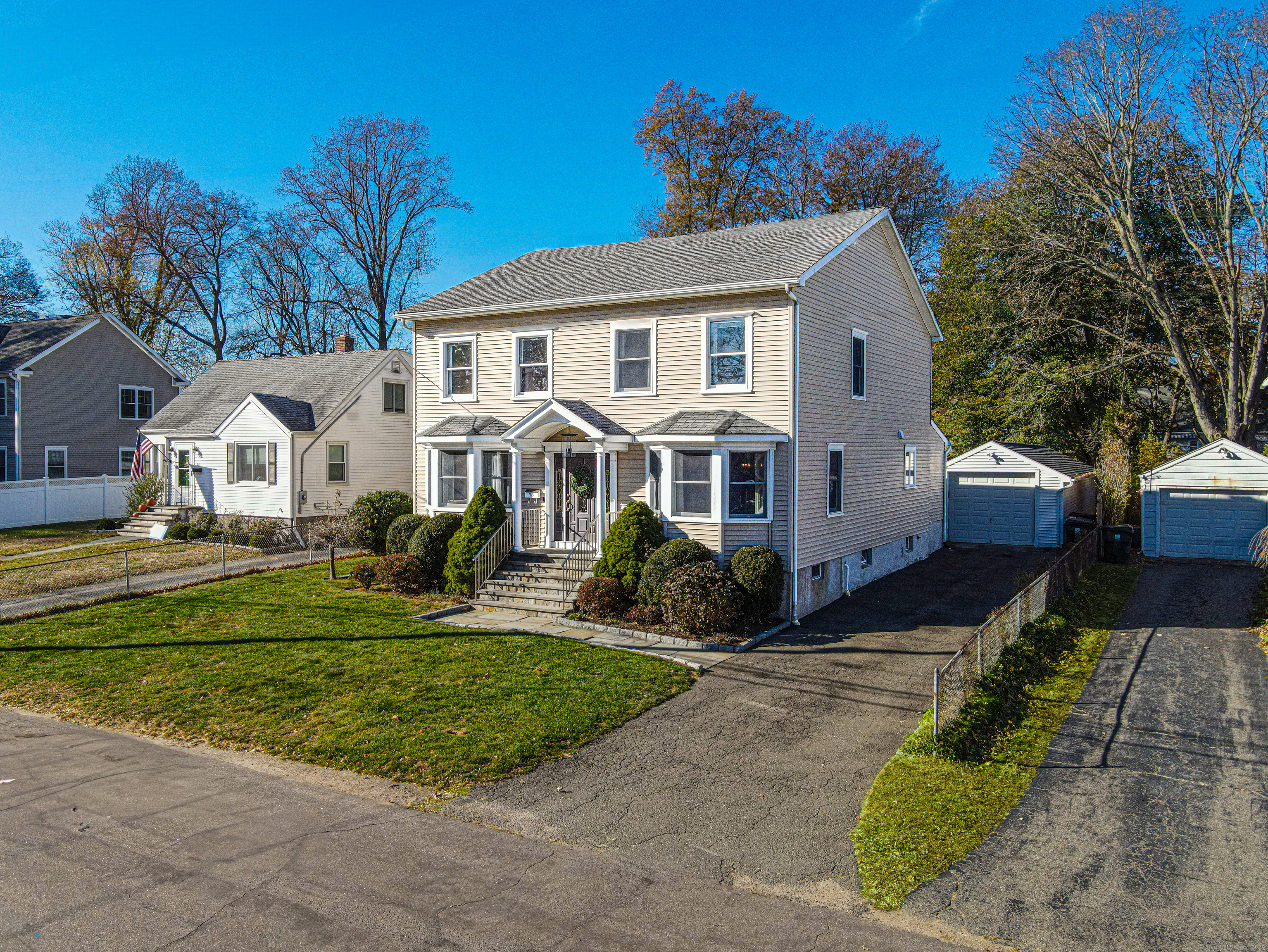 Welcome to this stunning 5-bedroom, 3-full-bath Colonial, beautifully renovated & located in the highly sought-after University Area of Fairfield. No detail has been overlooked in the transformation of this home, starting with the gourmet kitchen featuring white cabinets, quartz countertops with a striking waterfall edge, stainless steel appliances & a convenient walk-in pantry.The spacious great room, with soaring cathedral ceilings & large windows, provides an abundance of natural light & a great view of the private yard. Also on the main level, you'll find a first-floor bedroom offering flexibility/convenience, a large formal dining room & a gracious living room. The updated main level full bathroom with walk-in shower with glass enclosure adds to the home's appeal, as does the office/den with elegant French doors, perfect for working from home. Upstairs, the second floor boasts 3 additional generously sized bedrooms each featuring large closets with built-ins for added storage plus a primary bedroom suite- a true retreat, complete with a full walk-in closet & a designer bath. The walk-up third level space offers endless potential for future living space, providing additional flexibility as your needs evolve. Other features of the home include built-in audio & alarm system, wiring for a generator & a heated soundproof media room, home office/studio off the back of the garage. Located within close proximity to downtown nightlife, Fairfield Metro and all major highways.