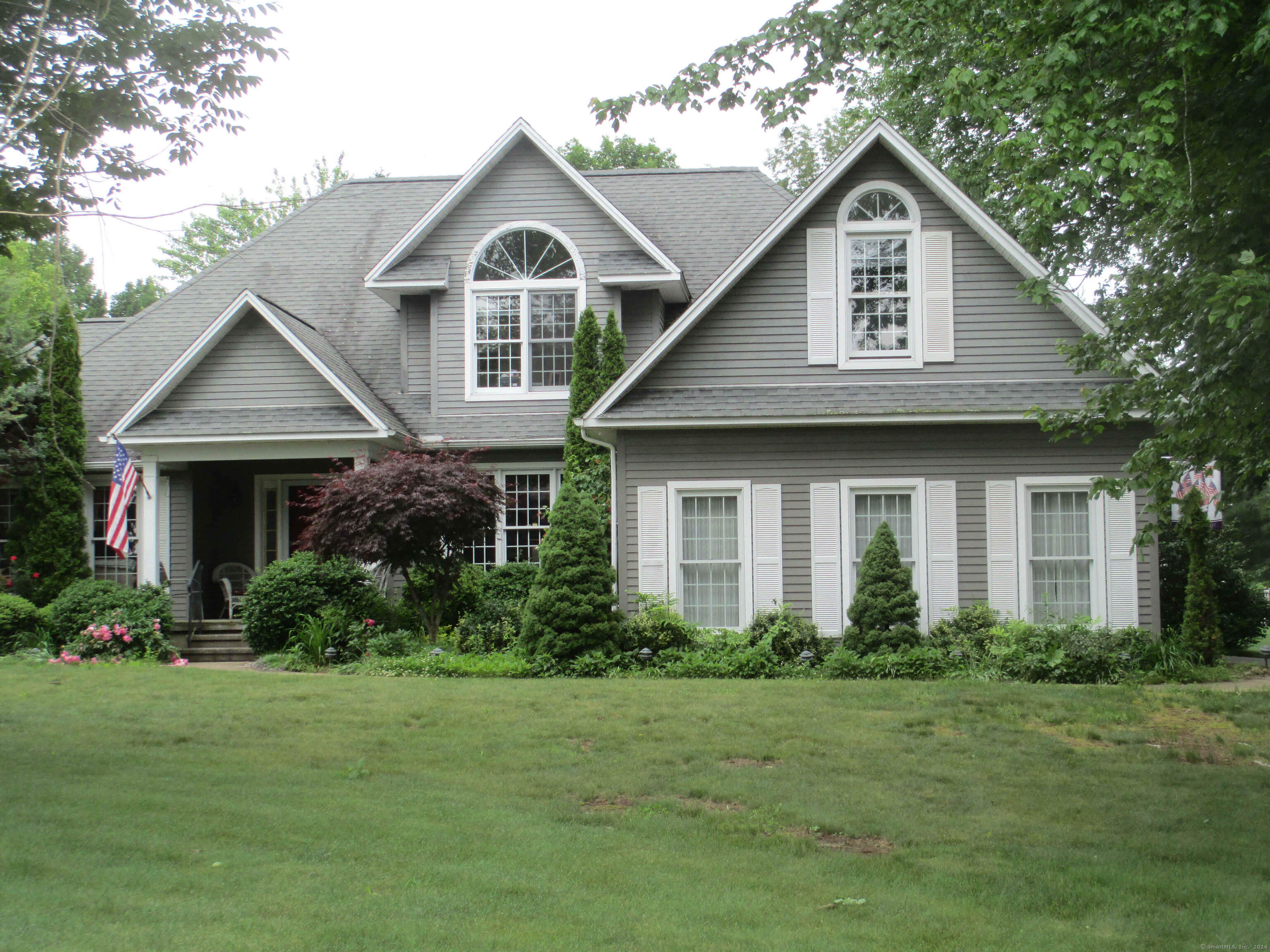 Charming Custom Colonial in East Hampton's Premier Valli Estates Discover this beautifully crafted 3-bedroom, 3-bathroom Colonial nestled in the heart of Valli Estates, one of East Hampton's most sought-after neighborhoods. Designed with comfort and entertaining in mind, this home boasts an inviting open floor plan. Step into the spacious living room, seamlessly connected to a bright eat-in kitchen. From there, enjoy direct access to the deck, overlooking a lush, flat, manicured lawn-ideal for gatherings, outdoor activities, or simply unwinding in a serene setting. The first-floor primary suite has a private retreat with plenty of space and natural light. Also on the main level are a generously sized dining room, a dedicated office perfect for remote work, and a convenient laundry area. Upstairs, you'll find two additional bedrooms, a full bath, and a versatile great room that can be tailored to suit your lifestyle-whether as a playroom, home gym, or media space. Conveniently located near the scenic Airline Trail, the charming town center, and the recreational opportunities at Lake Pocotopaug, this home affords both tranquility and accessibility. This is more than just a house; it's a lifestyle waiting to be embraced.