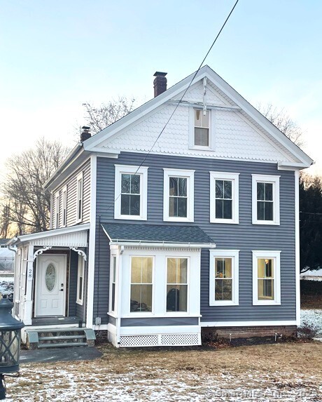 This 3-bedroom colonial has been transformed from top to bottom giving it a truly modern farmhouse feel. From the front you'll notice the classic gingerbread trim and charming front porch. Step inside and check out the first floor that has been opened up and has an inviting floor plan with large windows in living room and dining area that wraps right around to the kitchen. The kitchen has quartz countertops, breakfast bar/island with power, modern cabinetry and stainless-steel appliances. Light and durable bamboo flooring runs throughout along with modern lighting fixtures. An updated half bath with tile floor and laundry hook up is so convenient. Head upstairs and you'll find three bedrooms with warm wood laminate flooring. There has been one full bath added on the second floor with tile shower surround and flooring. There's more! A finished attic space that has so many possibilities. New roof and completely updated electrical system. Other newer updates include the windows, furnace, well & oil tank. Back porch and two car garage round out this fabulous home. Professional photos on the way.