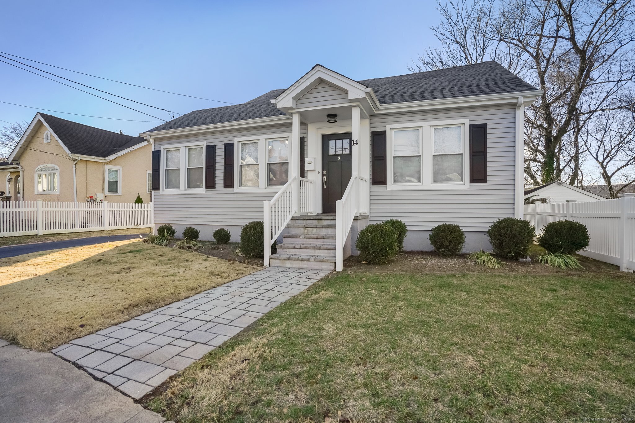 Updated storybook home with 3 bedrooms and 2 full baths sits in a ultra convenient area of Norwalk. When you open the front door you feel the love and coziness of both the open floorplan and decor. The well designed kitchen features quartz counter tops, updated cabinets, modern light fixtures and gleaming stainless steel appliances. Warm hardwood floors and a sun-drenched sitting room make the living space light and bright. The upper level serves as the primary suite making superb use of architecture, with 2 large closets and full updated bath with dual sink vanity. Unfinished heated lower level provides ample storage space, washer, dryer and utility sink. Newer mechanicals, central A/C, tankless water heater plus plenty of room for workout equipment AND potential hobby space. Neat, manicured level yard with easy access off the kitchen is ideal for BBQ, hardscape patio with canopy is Perfect for entertaining! 1 car detached garage with ample driveway for additional parking. Commuters dream of being this close to train, I-95 and Rte 7 connector. Walking distance to many amenities such as shopping, dining and recreation. This home is the perfect balance of updated casual elegance and low-maintenance living.