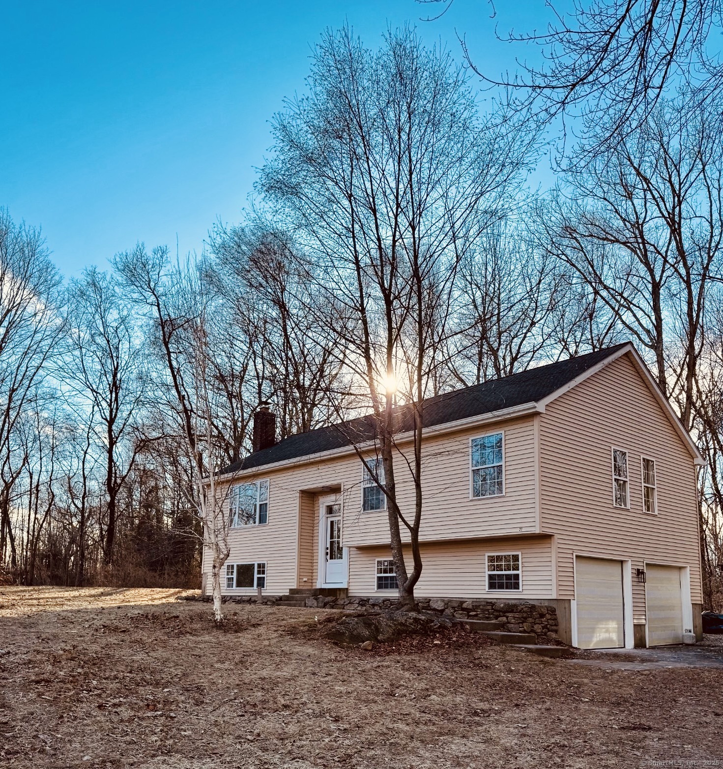 Look no further!! You are going to fall in love with this tastefully updated 3 bedroom/ 3 full bath Raised Ranch in Ashford CT. This move-in-ready home boasts a brand new kitchen with quartz counter tops and stainless appliances, 3 fully updated bathrooms, hardwood floors and fresh paint. You can't beat the convenience and layout of a raised ranch, this home has a great open floor plan and over 1600 square feet of living space. The living room has a fireplace, vaulted ceiling and dining area with banquet seating that leads to a beautiful private deck for indoor/outdoor entertaining!! There is a full laundry/mudroom room on the main level and two bedrooms, one of which is a primary bedroom with ensuite bathroom. The lower level has another spacious bedroom and full bathroom with tiled shower. This space has great potential and would lend itself well for additional living space, home gym, office or guest room. You truly can't beat this location, which gives easy access to major routes for commutes and plenty of options for shopping and restaurants!! Don't miss out on this opportunity!!