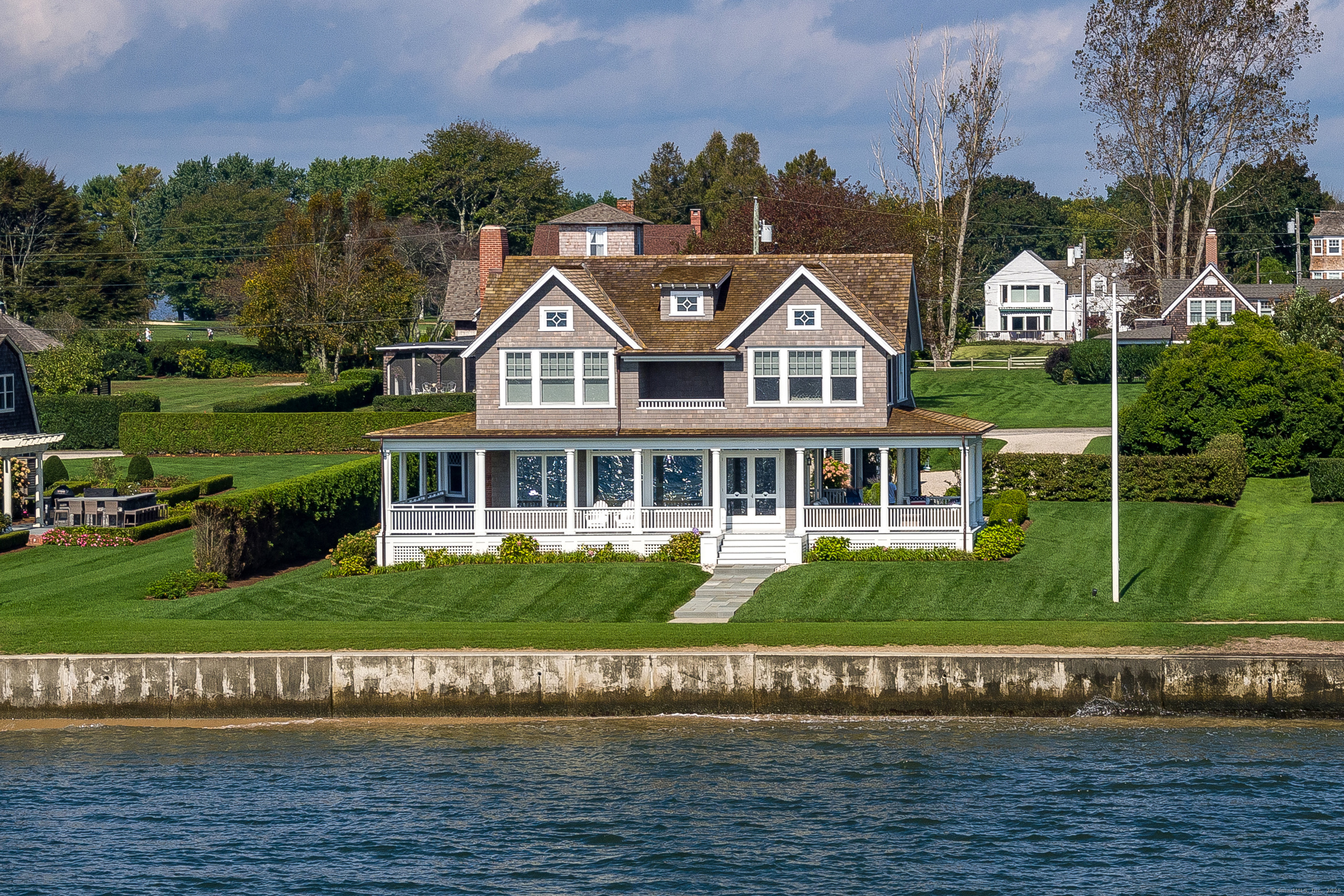 Escape to the serene shores of Long Island Sound with this exquisite six-week summer rental in the coveted Fenwick area of Old Saybrook, Connecticut. This traditional Fenwick Cottage has a harmonious blend of classic charm and modern luxury, making it the perfect waterfront getaway for relaxation and entertainment. Spacious waterside family room featuring a magnificent fieldstone fireplace, creating a warm and inviting atmosphere for family time or quiet contemplation. A large, beautifully designed chef's kitchen with top-of-the-line appliances, an inviting eating area, and a wet bar, catering to culinary enthusiasts and effortless hosting. Expansive covered wrap-around porch with a cozy outdoor fireplace and a luxurious hot tub, perfect for evening relaxation or social gatherings. This Fenwick summer rental is not just a home; it's a retreat that promises unforgettable moments and tranquility amidst the natural beauty of the shoreline. Whether you're basking in the sun, enjoying the hot tub under the stars, or preparing gourmet meals in the chef's kitchen, this property will be an unparalleled summer experience. To schedule a private viewing and embrace the opportunity to make this dreamy coastal haven your own for the summer. Discover the magic of Fenwick and create memories that will last a lifetime.