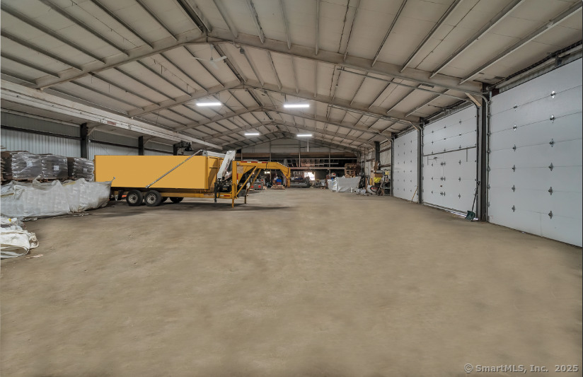 Spacious warehouse available for lease at this 8, 040 sq. ft. space (134' wide x 60' deep) is designed for functionality, featuring four oversized overhead doors (13.5' wide x 11.9' high), a ceiling height of 19.2' at the peak and 13.5' at the eaves, and an interior overhead door connecting to additional spaces. The warehouse boasts LED motion-activated lighting, a brand-new roof installed in 2025, and convenient ground-level access. Perfect for storage, operations, or logistics, this unheated space offers versatility and easy accessibility from Route 80.