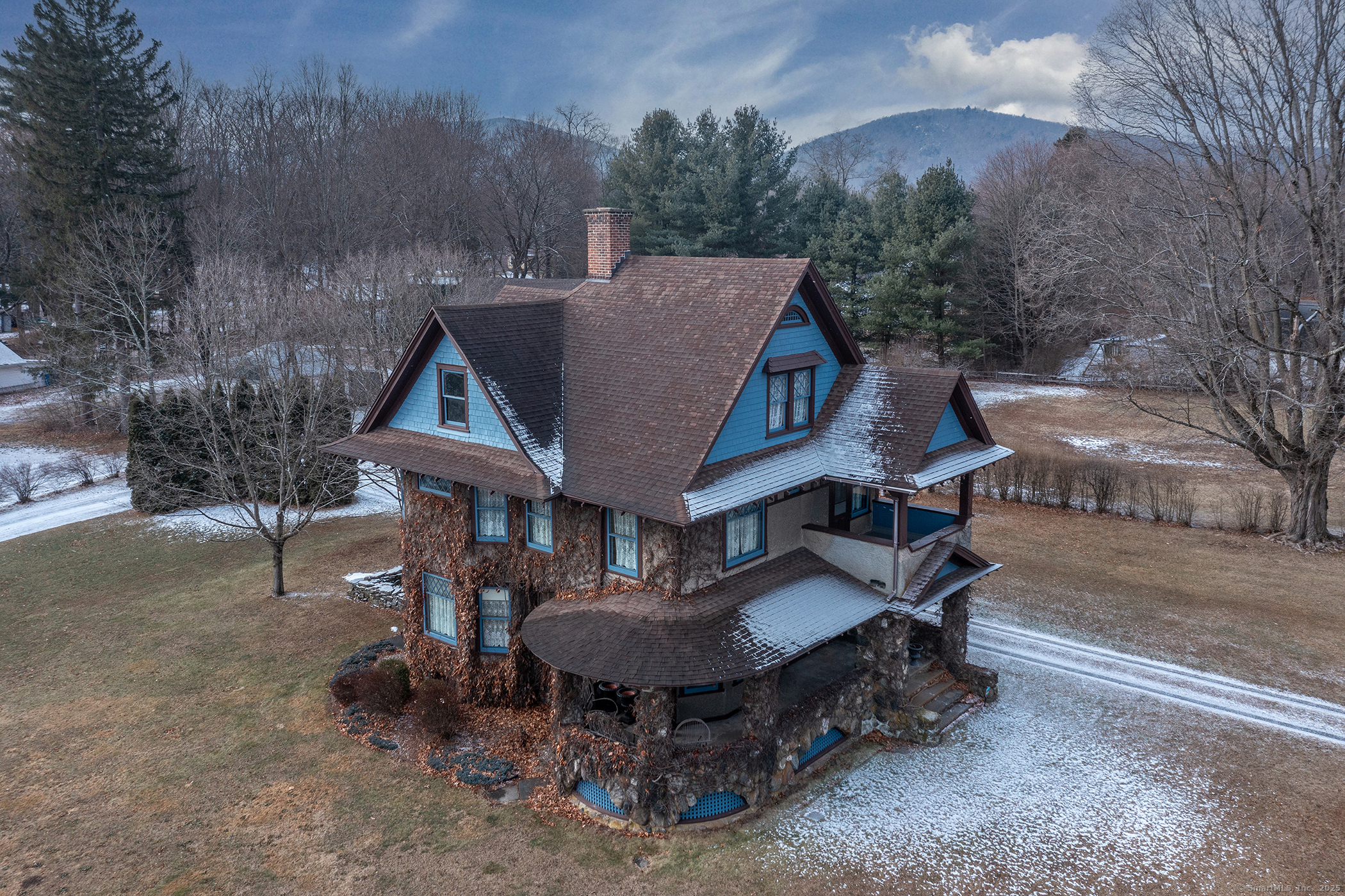 Introducing Alwynds ~ a quintessential 1911 Craftsman-style residence, proudly situated in the center of Pine Plains in the enchanting Hudson Valley region of NYS. This impressive home has been lovingly maintained by its owners for over four decades, a testament to its enduring appeal and solid construction. Alwynds exudes classic Craftsman charm, with its distinctive combination of stone and stucco facade and elegantly adorned with Boston ivy, creating a picturesque setting that captures the imagination. Step inside to discover a treasure trove of original features including oak flooring, a magnificent stone fireplace, and rich chestnut trim that frames each room with warmth and character. The kitchen features beautiful custom cabinets and high-end appliances. The formal dining room, with its refined ambiance, is perfect for hosting memorable gatherings, while the cozy and well-appointed living spaces invite relaxation and everyday enjoyment. Upstairs, three bedrooms offer peaceful retreats, each infused with the home's inherent charm. A large attic presents endless possibilities for creative use or storage. Outside, the property's grandeur continues with a two-story barn/garage that echoes the home's craftsmanship, providing ample space for vehicles, hobbies, or additional storage. The balance of the 1.2 acres includes a garden shed, beautiful gardens, and a thriving orchard, offering a pastoral escape and the potential for garden parties and outdoor activities. Alwynds i