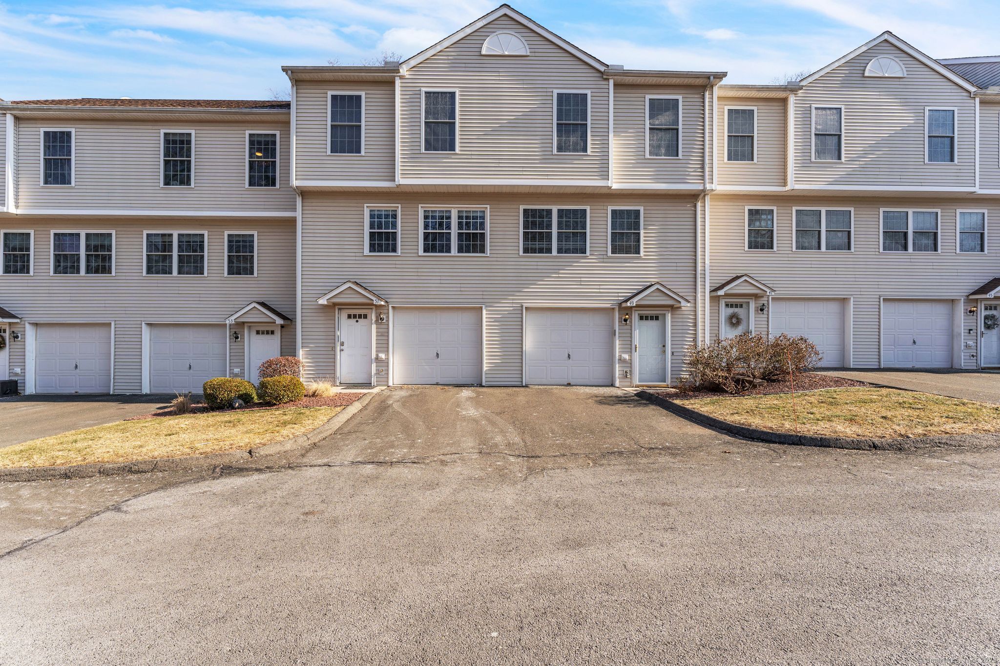 This charming 2-bedroom, 1.5-bath condo is conveniently located just off Rt 30, near Buckland Hills Shopping and with easy access to Rt 84. Set in a quiet, park-like community, this unit boasts a tiled entryway and wood floors throughout the living room, kitchen, and dining area. The updated bathroom features a tiled shower and modern fixtures. Enjoy cozy evenings by the gas fireplace and take advantage of plenty of parking. Additional amenities include central air, ceiling fans, large closets, and extra storage in both the basement and garage. A slider door leads to a deck overlooking the open backyard. Laundry facilities are located in the basement. Low condo fees make this an excellent opportunity for comfortable, easy living.