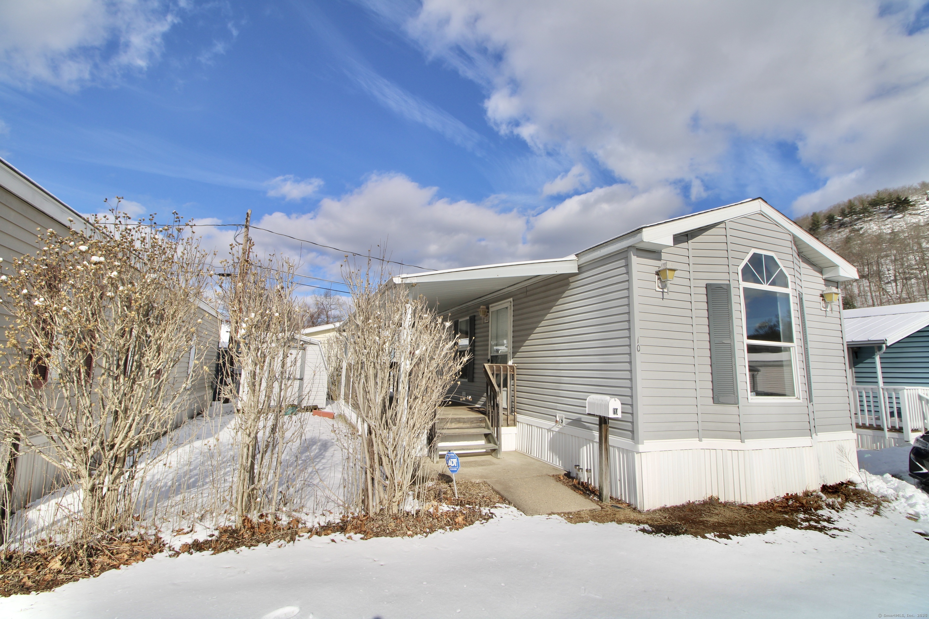 Welcome to 10 1st Street, a recently renovated mobile home located in a quiet and peaceful neighborhood in Beacon Falls, CT. This property provides a serene setting near a stream, perfect for those seeking a calm and relaxing environment. The home features fresh interior updates, making it move-in ready, while the yard provides space for gardening or enjoying the outdoors. A convenient storage shed adds extra functionality for tools, equipment, or seasonal items. Enjoy the benefits of property management, including snow removal, trash pickup, and grounds maintenance, allowing you to focus on enjoying your home without the hassle of upkeep. The location also provides easy access to major highways and is close to a nearby storage facility for added convenience. This property is the perfect combination of tranquility, convenience, and low-maintenance living.