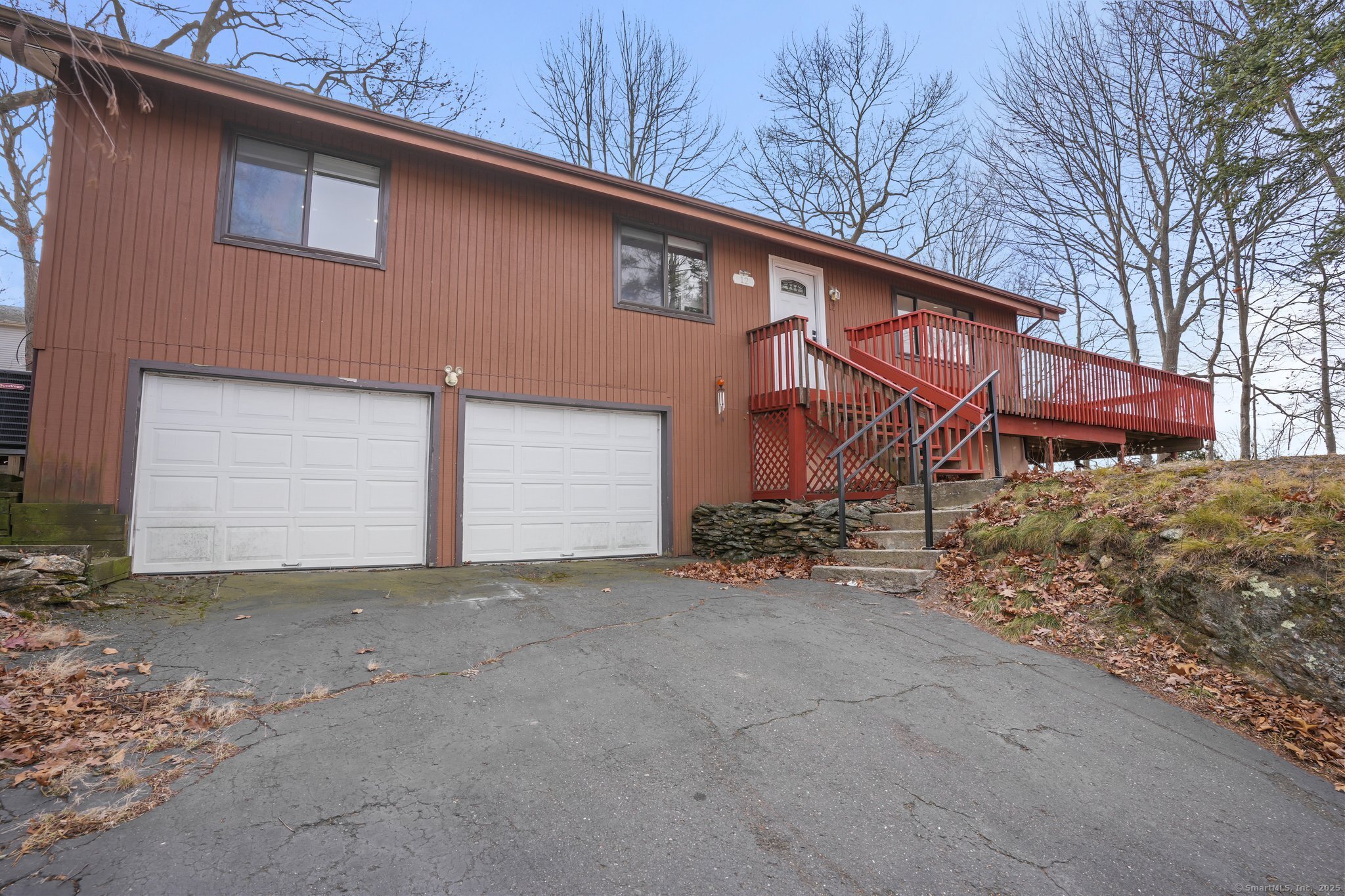 Welcome to your dream home in Waterbury! This stunning single-family residence offers 3 bedrooms, 2 full bathrooms, including a primary bedroom suite for added luxury. Spanning 1, 400 square feet, with an additional 650 square feet of unfinished potential in the lower level, this home is perfect for both living and expansion. The open-concept layout features granite countertops, stainless steel appliances, beautifully polished hardwood floors throughout, recessed LED lighting, and modern finishes. Step outside to enjoy the wrap-around deck with captivating hilltop views, accessible through French doors and two sliding doors, making it ideal for entertaining. Nestled on a .34-acre lot at the end of a peaceful cul-de-sac, this property offers privacy and serenity. The roof was replaced just three years ago, and the home boasts a spacious two-car garage for added functionality. Don't miss this gem - it's a perfect combination of style, comfort, and location!