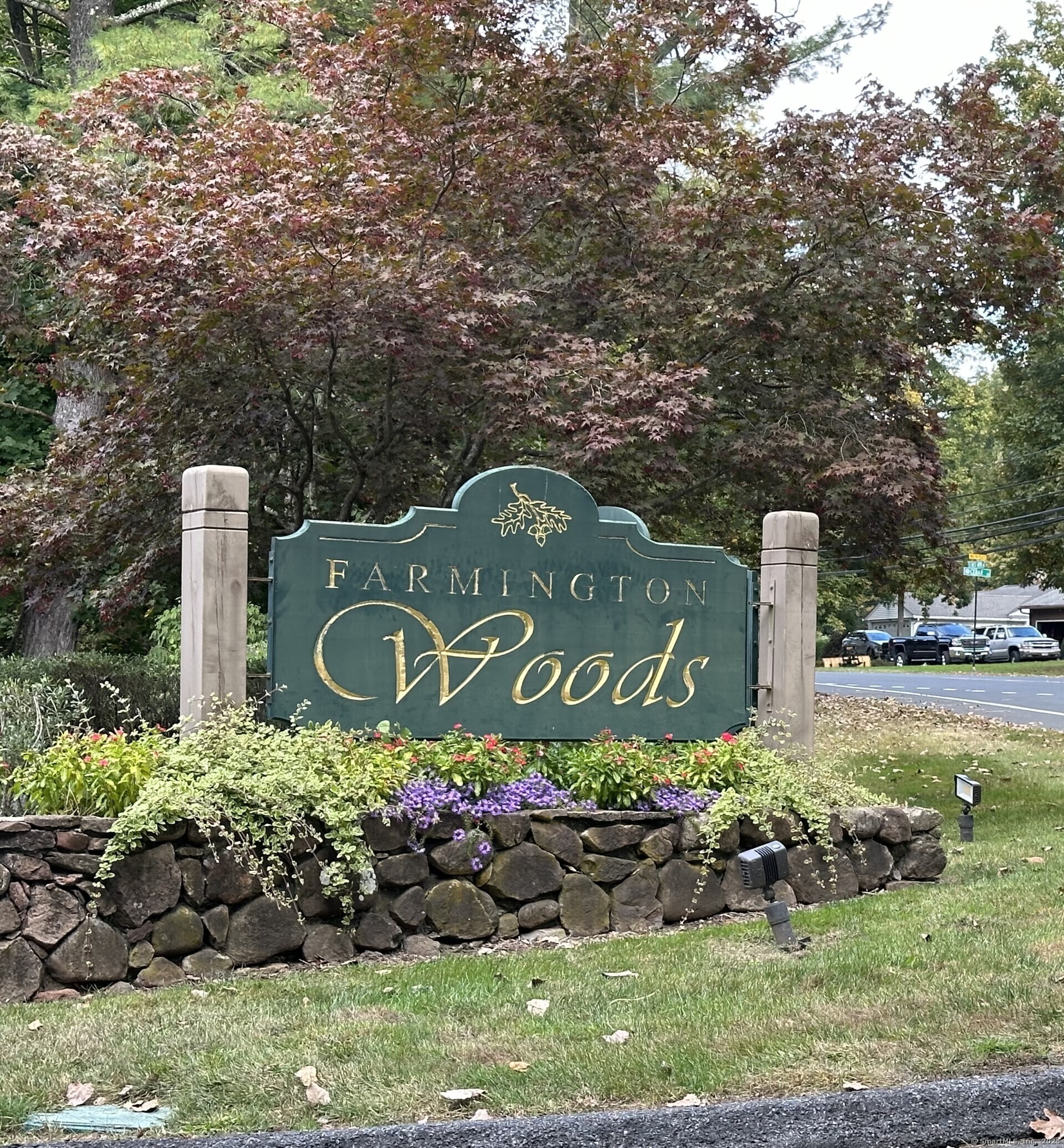 Welcome home to this charming 3-bedroom, 2-bath end-unit townhouse in the highly sought-after Farmington Woods gated community! This vibrant neighborhood offers an array of amenities, including multiple pools, tennis courts, a PGA-rated golf course, paddleball court, community gardens, serene ponds, a clubhouse, and an on-site restaurant. The first floor boasts an open floor plan with a cozy wood-burning fireplace in the living room, a dining area, and a remodeled kitchen featuring granite countertops and stainless steel appliances. Enjoy the outdoors from the screened porch, conveniently located off the main living space. The primary bedroom includes an updated en-suite bath, and a second bedroom, which could double as a den, completes the main level. Upstairs, you'll find a versatile loft area-perfect for a home office or family room-along with an additional bedroom, a full bath, and a walk-in attic for ample storage.