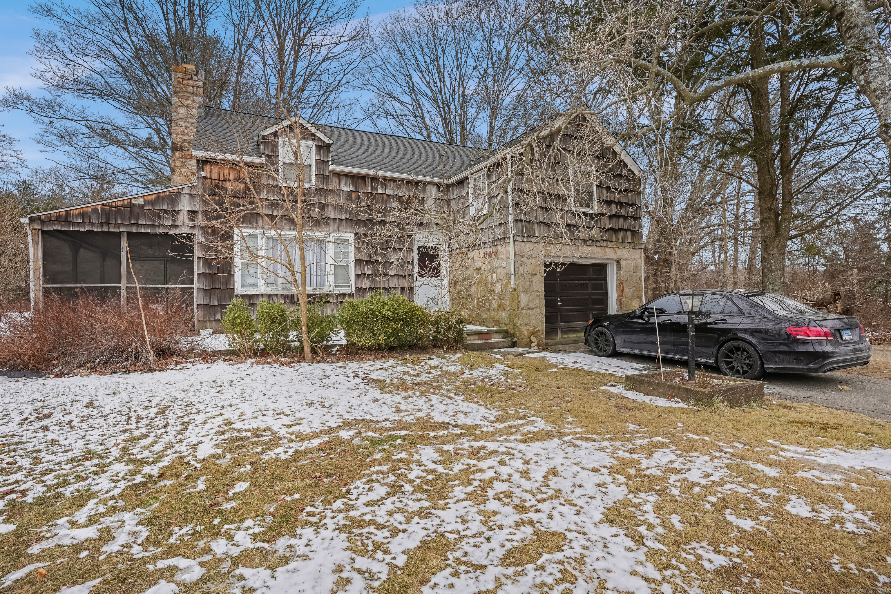 Charming Colonial Cape Cop located close to everything in Monroe. Large living room/Dining room with hardwood floors and large stone wood burning fireplace, screened porch the perfect spot for a BBQ or cold drink on a hot summer day, eat in kitchen, covered porch. Second floor features large bedrooms with hardwood floors and large closets. Large level usable back yard. Great starter home in a great town with great schools. Incredible potential with TLC. Potential flip.