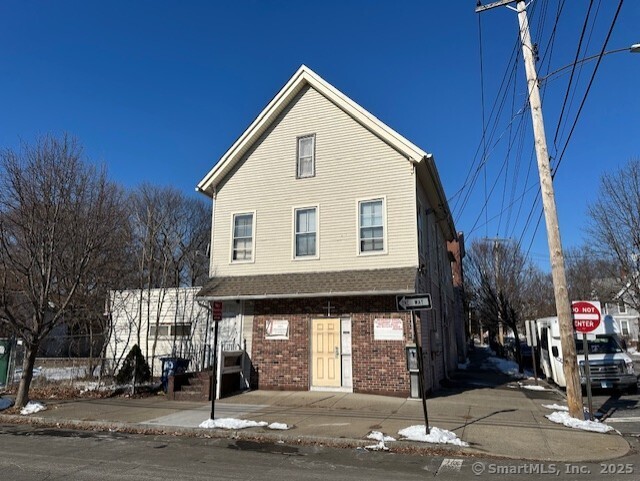 Building was being used as a Church reason for - No Property Tax on the property, but could be converted back to a Multifamily. Excellent Location!!! This two family unit has a parking lot, and additional building and lot. The lower unit was used as a church with two baths, large open space room and plenty of storage areas. The second floor unit has its own entrance and was used by the caretaker and has two bedrooms and 1 full bath. Needs renovation, selling As Is condition....Big Potential...Priced to Sell!!!