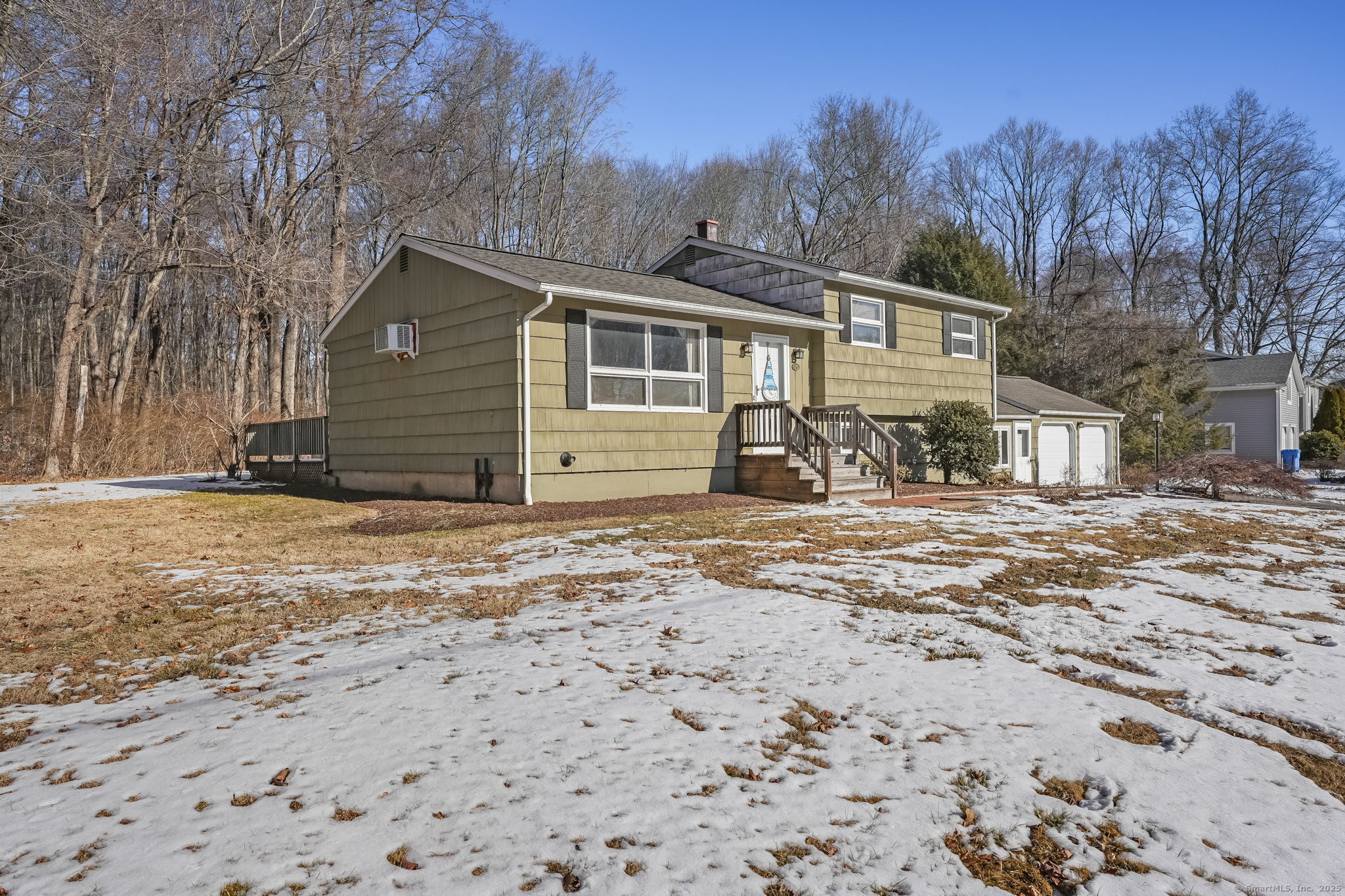 Situated on a quiet dead-end street in a convenient section of Monroe near the Trumbull line, this charming property offers a fantastic opportunity to build equity in one of Fairfield County's most desirable small towns. Set on over an acre of land, the home boasts a private, picturesque backyard with an expansive deck-perfect for relaxing / entertaining-while being just minutes from shopping, dining, and major commuter routes. Inside, the home features hardwood floors on the main level and a beautifully remodeled hallway bathroom. The bright and versatile enclosed breezeway adds an additional 240 square feet of flexible living space (not included in the total square footage), offering great potential for finishing. A spacious two-car garage, paired with a large detached shed, provides plenty of room for storage, hobbies, or projects. This property also comes with rare and highly sought-after utilities for Monroe, including city water, natural gas, and a newer energy-efficient gas-fired on-demand hot water heater. Located within Monroe's prestigious Blue Ribbon Award-winning school district, the home is perfectly positioned for those seeking both quality education and convenience. Offered at a rare price point for Monroe, this home presents incredible potential to update and make it your own. Don't miss this chance to embrace a serene lifestyle in a highly sought-after neighborhood. Priced to sell 'as-is'. Subject to seller finding suitable housing, inquire for details.