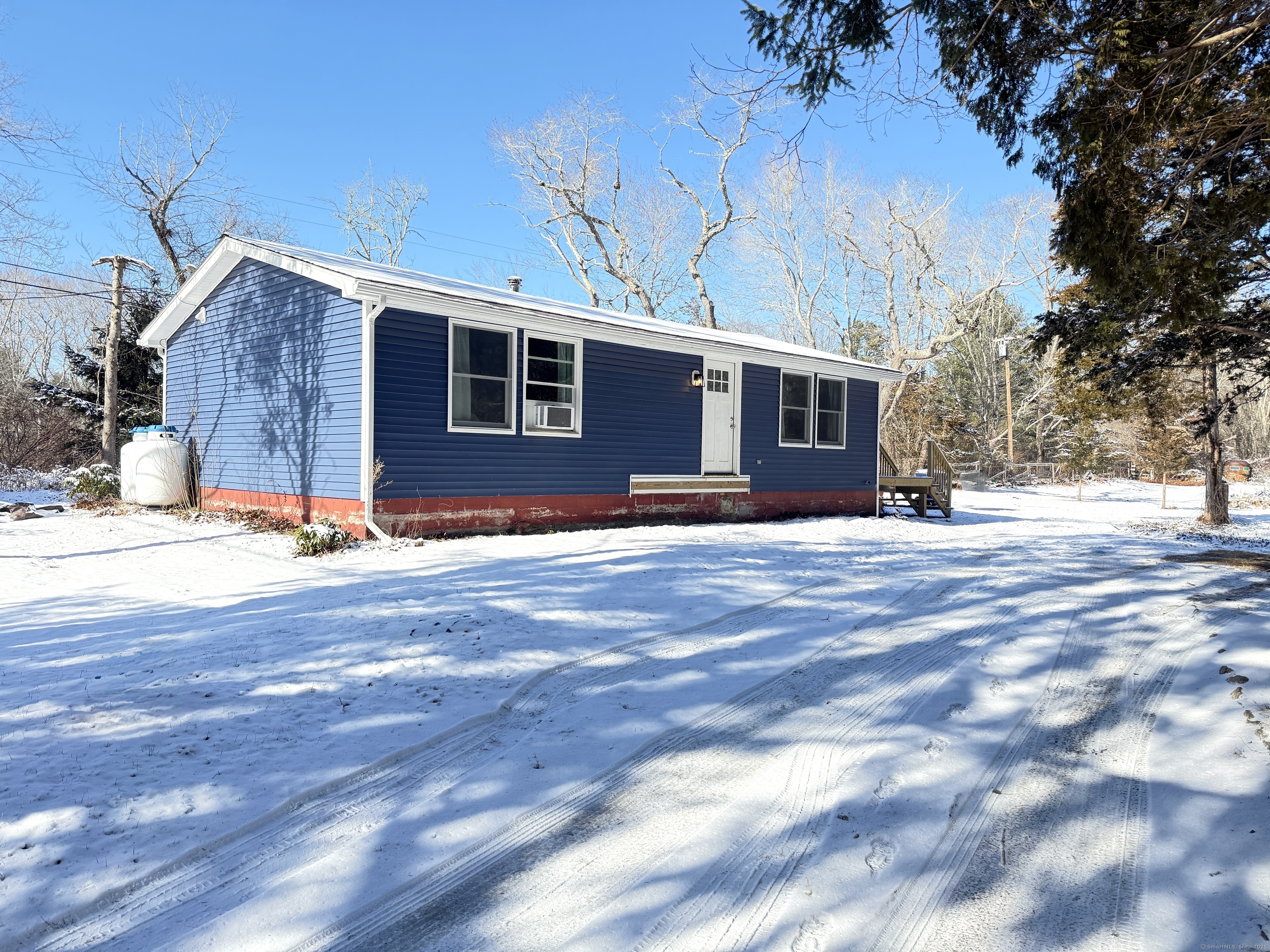 Recently remodeled and brimming with charm, this ranch-style home on 1.40+/- acres in Lyme blends modern comfort with a serene setting. Inside, the spacious living room welcomes you with brand new flooring, flowing seamlessly into the redesigned kitchen and dining area-perfect for hosting gatherings. The kitchen boasts quartz countertops, stainless steel appliances, and thoughtful updates throughout. With two bedrooms and a full bath, the home offers a cozy yet functional layout. The large deck is an ideal spot to relax and take in the expansive backyard views. Located near local treasures like the Hadlyme Country Market, historic Hadlyme Ferry, and Gillette Castle, this home also offers easy access to Lyme Land Trust preserves for endless outdoor adventures. This home is a rare find-schedule a tour today!