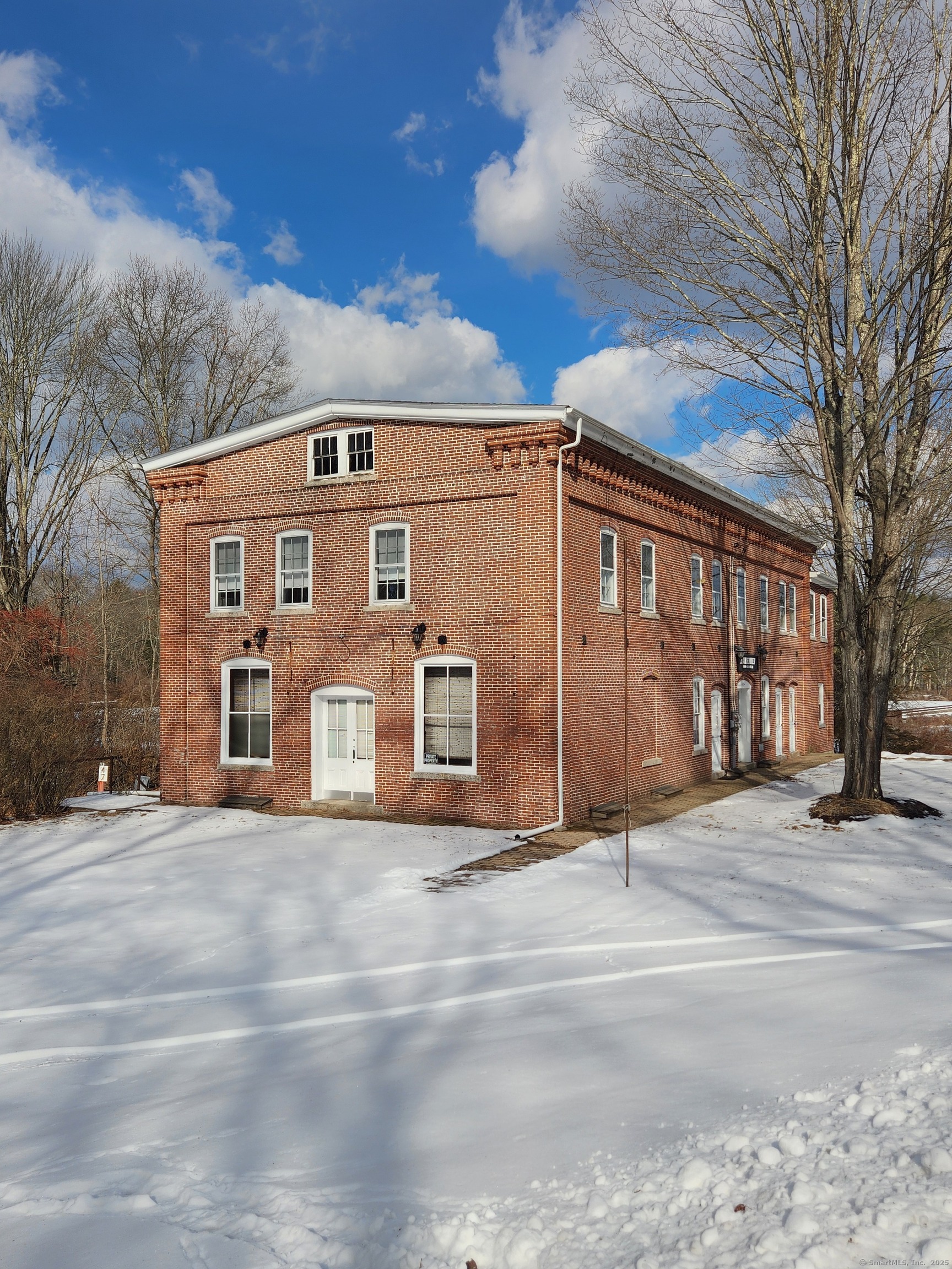 Unlock the Potential of This Historic Multi-Family Property Located in Connecticut's Quiet Corner! Step into a piece of history, an unbeatable investment opportunity for the savvy investor or homeowner. This is a remarkable multifamily property featuring 3 residential units along with what was formerly used as a commercial space for a post office and a storefront, long ago. Units 1, 2 & 3 boast generous layouts with beautiful hardwood floors and timeless appeal. Two of the units feature 3 bedrooms, one unit has two bedrooms. In the middle of the building is a 4th unit which was where the storefront used to be. This space has two huge rooms with a half bath. This unique property presents ENDLESS possibilities. Nestled in a prime, peaceful location surrounded by local amenities such as local vineyards & breweries, antique shops, picturesque drives, and Acme Pond. Schedule a tour TODAY!