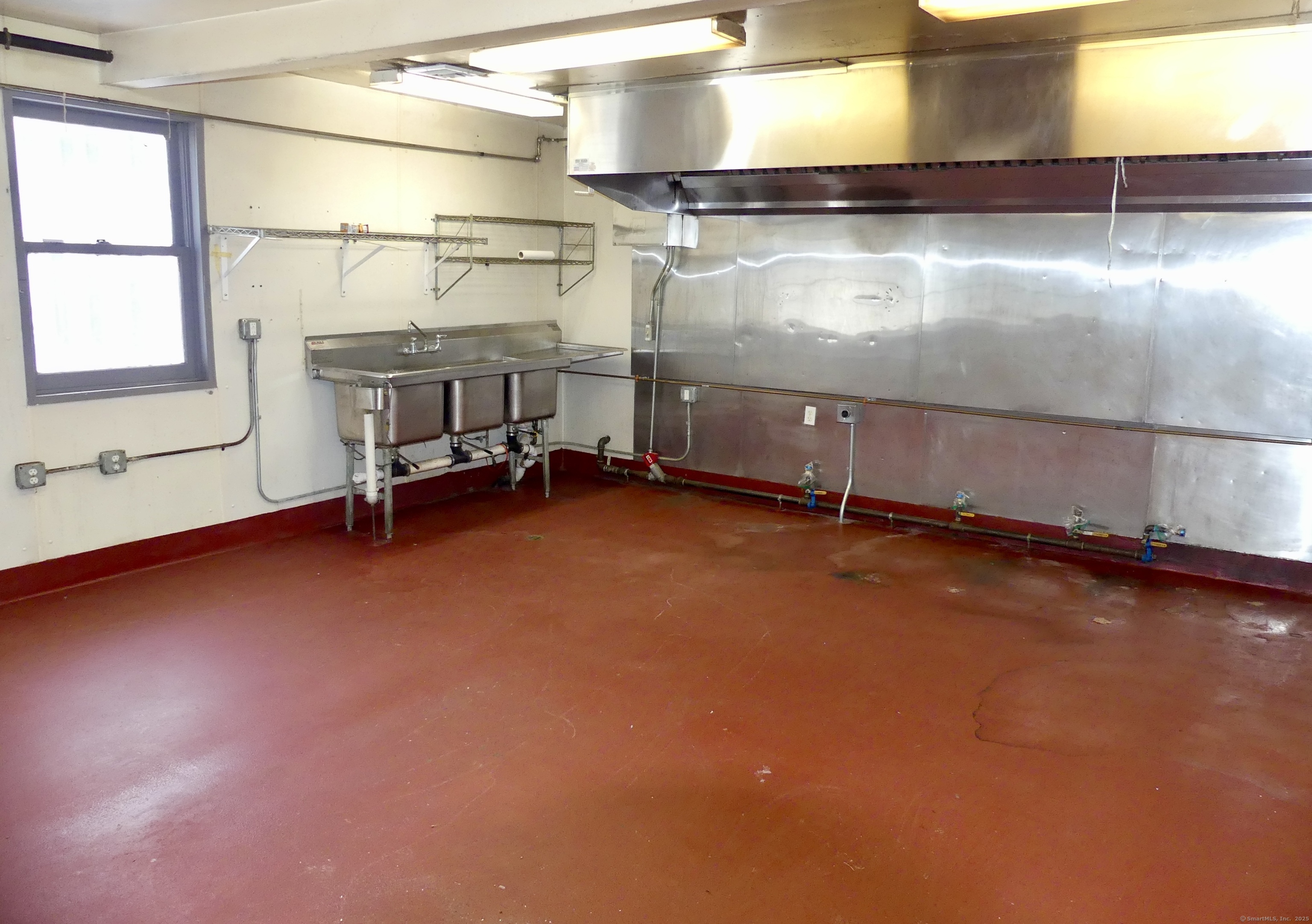 Two commerical kitchens - tenant must bring in their own equipment. Ansul system in place. Rent is gross and includes the two kitchens, small office, basement and a greenhouse. Ample parking.