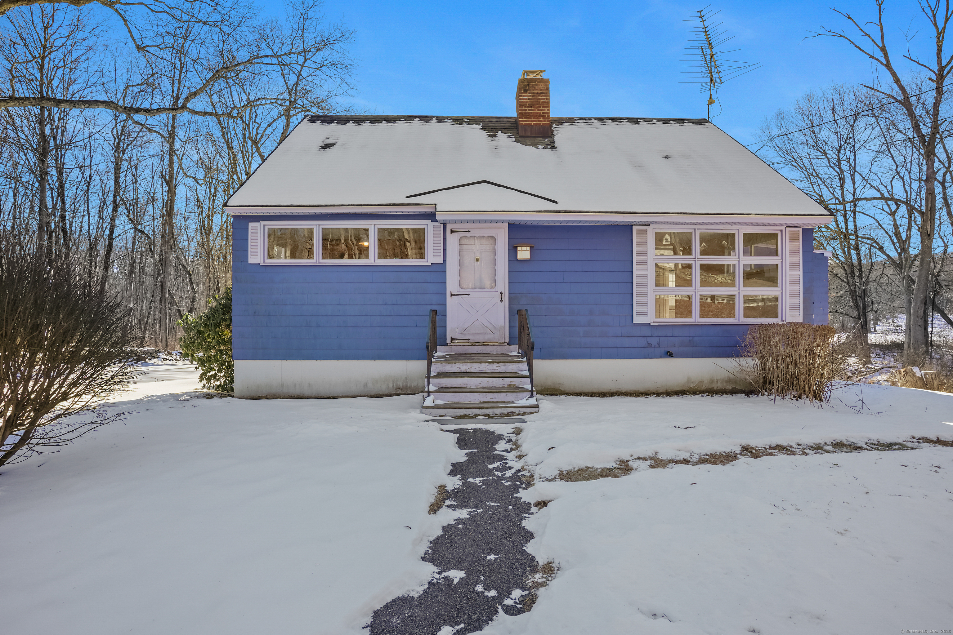 Lots of potential with this adorable home, just into Woodbury. Bring your fresh ideas to this Cape with many positive attributes. Yes, it needs updating however, main level has hardwood floors, full bath, living room with fireplace, kitchen & dining area plus two bedrooms. There is a whole house propane generator, and the electrical panel was updated. Furnace around 2022, water heater around 2023, roof approx 10yrs, plus chimney was capped and repointed. Dates are approximate, estate being sold as is. There are two bedrooms and roughed-in bath on the upper level not included in the square footage.