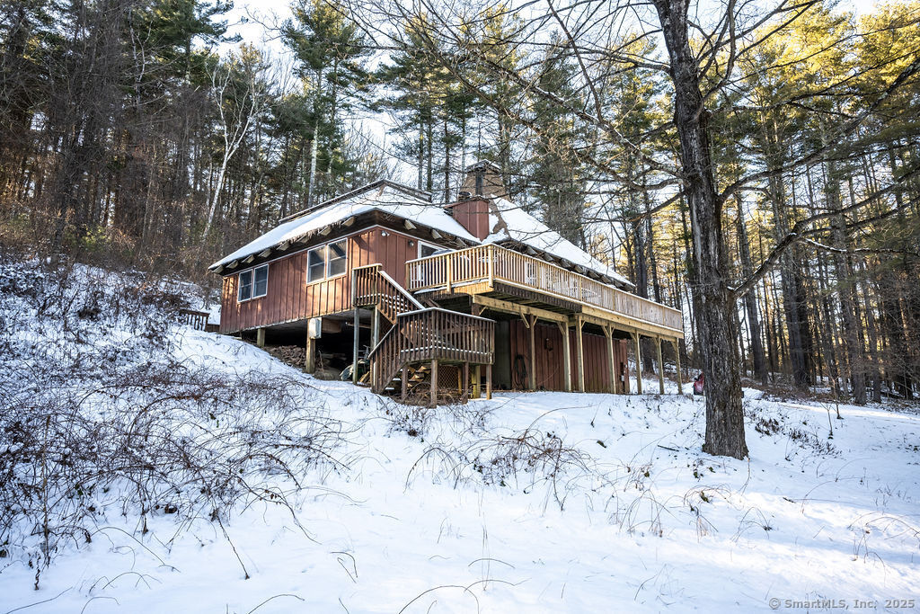 Nestled in the heart of the Berkshires, this charming mid-century cottage embodies quintessential New England living. Once connected to music legend Carole King, the home provides a unique blend of history, natural beauty, and cozy elegance. Featuring 3 bedrooms, 2 bathrooms, office and a versatile loft, the home is bathed in natural light and showcases retro design touches that add warmth and character. The inviting living spaces are perfect for relaxing after a day of exploring the nearby cultural and outdoor attractions. The 40 foot private deck is a serene retreat, ideal for soaking in the tranquil surroundings or entertaining friends and family. Located in a small-town setting rich with music history, you'll enjoy easy access to scenic trails, vibrant cultural events, and outdoor recreation. Mohawk Ski Mountain is just 10 minutes away, making this property a dream for nature lovers and adventurers alike. Also, even though it's tucked away on Amy Road, it's just two minutes from the little town center where there's Bunny William's 100 Main shop, Falls Village Inn (filled with Lime Rock lore) and Center on Main (known for 12 Moons Coffee House and Falls Village Theater). And it's five minutes from Isabella Friedmann retreat center and Mountainside Cafe.