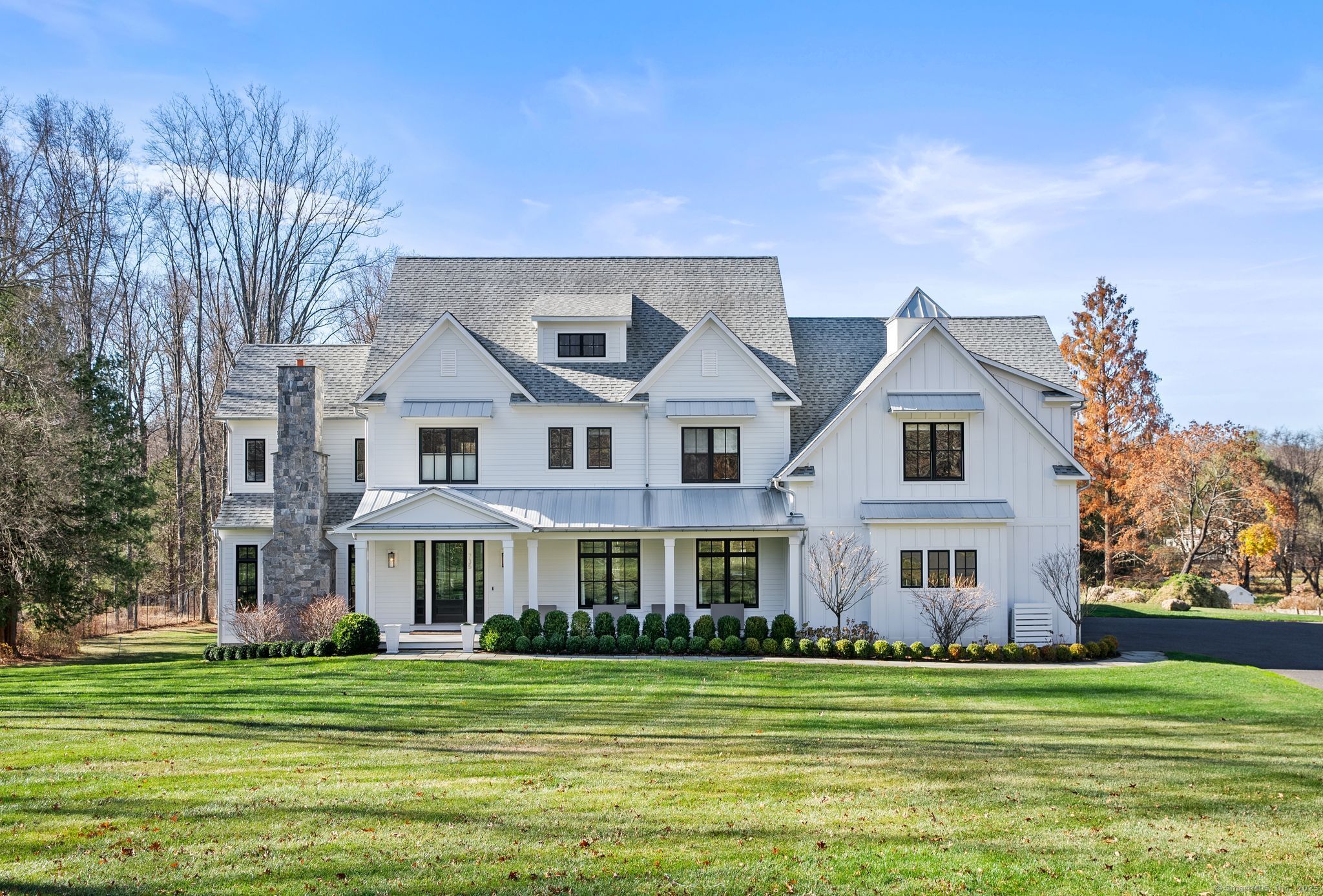 Welcome home to a breathtaking estate where timeless elegance meets modern luxury. Set on over 3 acres of park-like grounds in coveted lower Greenfield Hill, this extraordinary Colonial is a masterpiece of design offering an open-concept layout, soaring 10 ft ceilings & oversized 6 ft windows throughout; flooding the home w/natural light & capturing spectacular southwesterly views. The chef's kitchen is an entertainers dream w/custom cabinetry, 11 ft island, butlers pantry, walk-in pantry & breakfast room w/ French Doors to deck. Grand family room w/wood burning fireplace & coffered ceiling. Formal dining room stuns w/8 ft. glass doors for wine storage. Gorgeous home office w/custom built-ins & gas fireplace. Upstairs, a sublime master suite w/lit tray ceiling, gas fireplace, extraordinary custom outfitted his & hers walk-in closets, luxurious marble bathroom & breakfast bar w/refrigerator & sink. Add'l 4 large bedrooms all w/walk in closets. Au pair/in law suite w/separate back staircase entrance. Exquisite 2 story mudroom w/custom built-ins & add'l 1st fl powder room. 2000 sq ft. finished walk-out lower level w/gym, 2 add'l bathrooms, kitchen, wood burning fireplace, storage & safe room. Add'l features include: irrigation, new stone wall, fence & automatic front gate, 5'' white oak floors throughout, designer light fixtures, 3-car heated/AC garage w/14' ceilings, CAT 6 wired throughout, gas heat, solar panels, deer fenced. Approx. $500k in improvements by current owner.