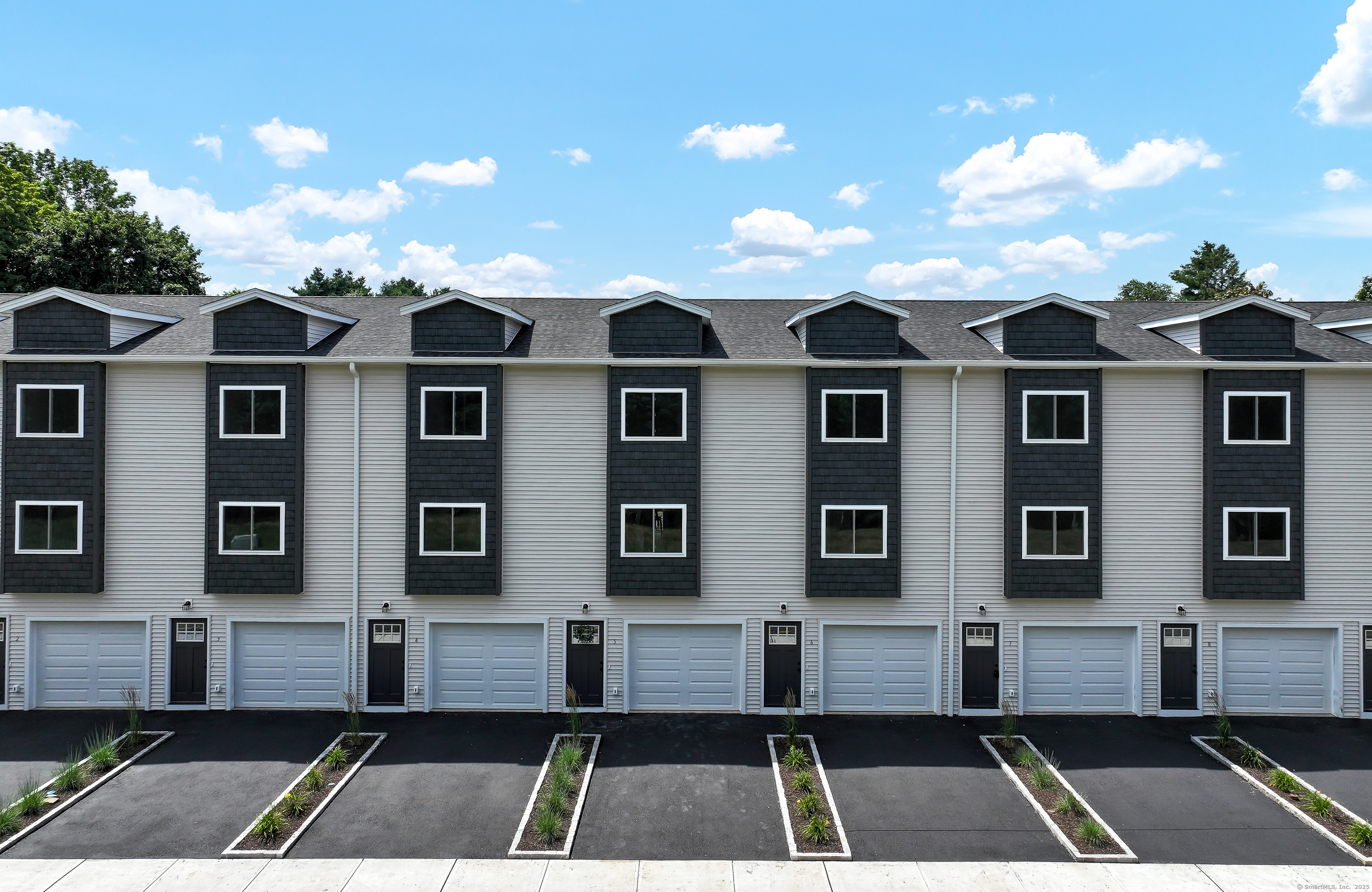 Welcome to Constant Falls, South Meriden's latest new construction townhomes. Designed for modern living, these homes effortlessly combine style, comfort, and functionality. The main level exudes sophistication, featuring white custom cabinetry, quartz countertops, and stainless steel appliances, deck, living room, and powder room. The second floor offers two bedrooms with ensuites, walk-in closets, and a laundry room. The lower level includes a one-car garage and a bonus room, perfect for a family room or office, with access to a patio. Conveniently located near local restaurants, Habershon Park, RT71, RT5, and just minutes from RT15 and I91. Schedule your tour today! This unit is and end unit in Bldg 2. There are multiple units available.