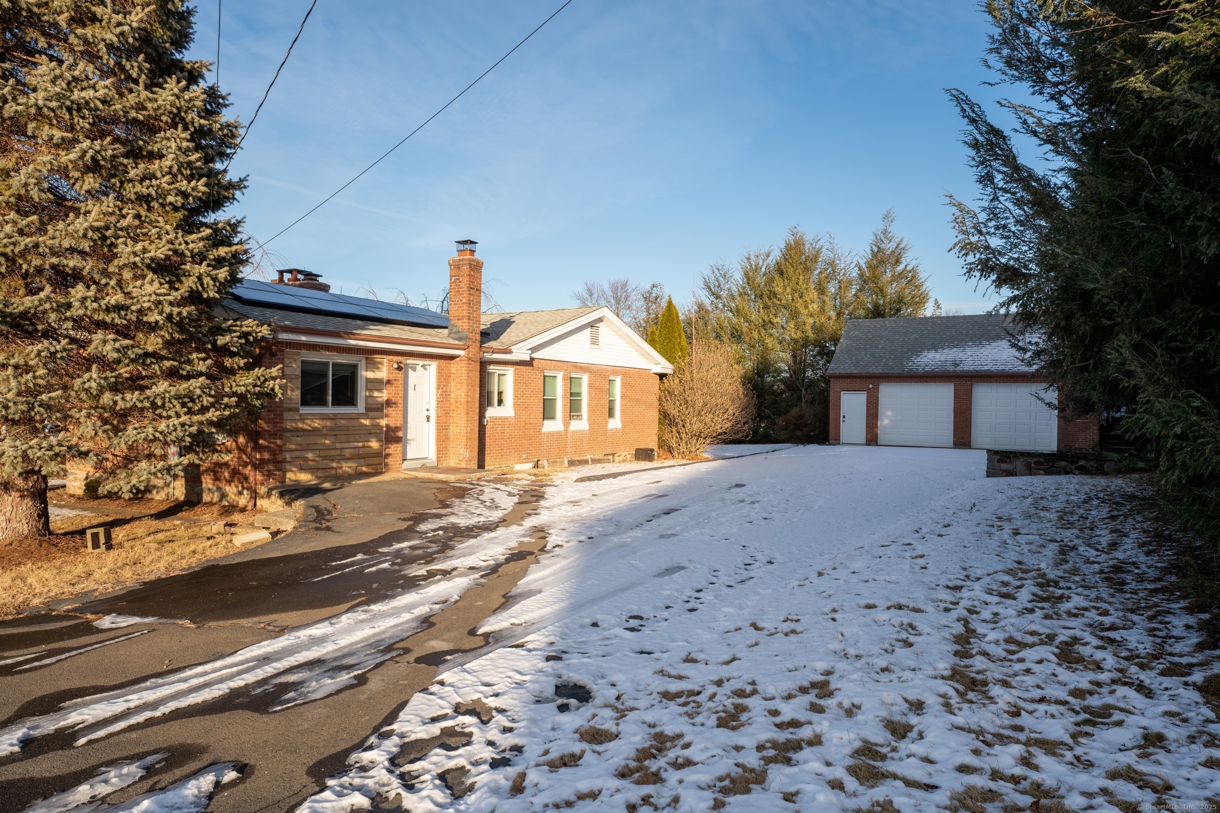 Great Investment Opportunity! This 2-bedroom, brick-sided ranch sits on a desirable corner lot near Central High School and is full of potential. While the home needs some TLC, it offers a fantastic layout and solid bones, making it a great investment or fixer-upper project.  Inside, you'll find a spacious living room with a charming fireplace that flows into the formal dining area. The kitchen features brand-new flooring, offering a fresh start for your updates. A beautiful wood-paneled room can serve as a 3rd bedroom or office space. The partially finished lower level is a blank canvas ready for your creativity w/ potential for additional living space, and featuring a second fireplace and half bath.  Outside, the property features a detached 2-car garage with storage above and plenty of parking. Solar panels keep energy efficiency high with low electricity costs. With the right vision, this home can truly shine-don't miss out on this promising deal!