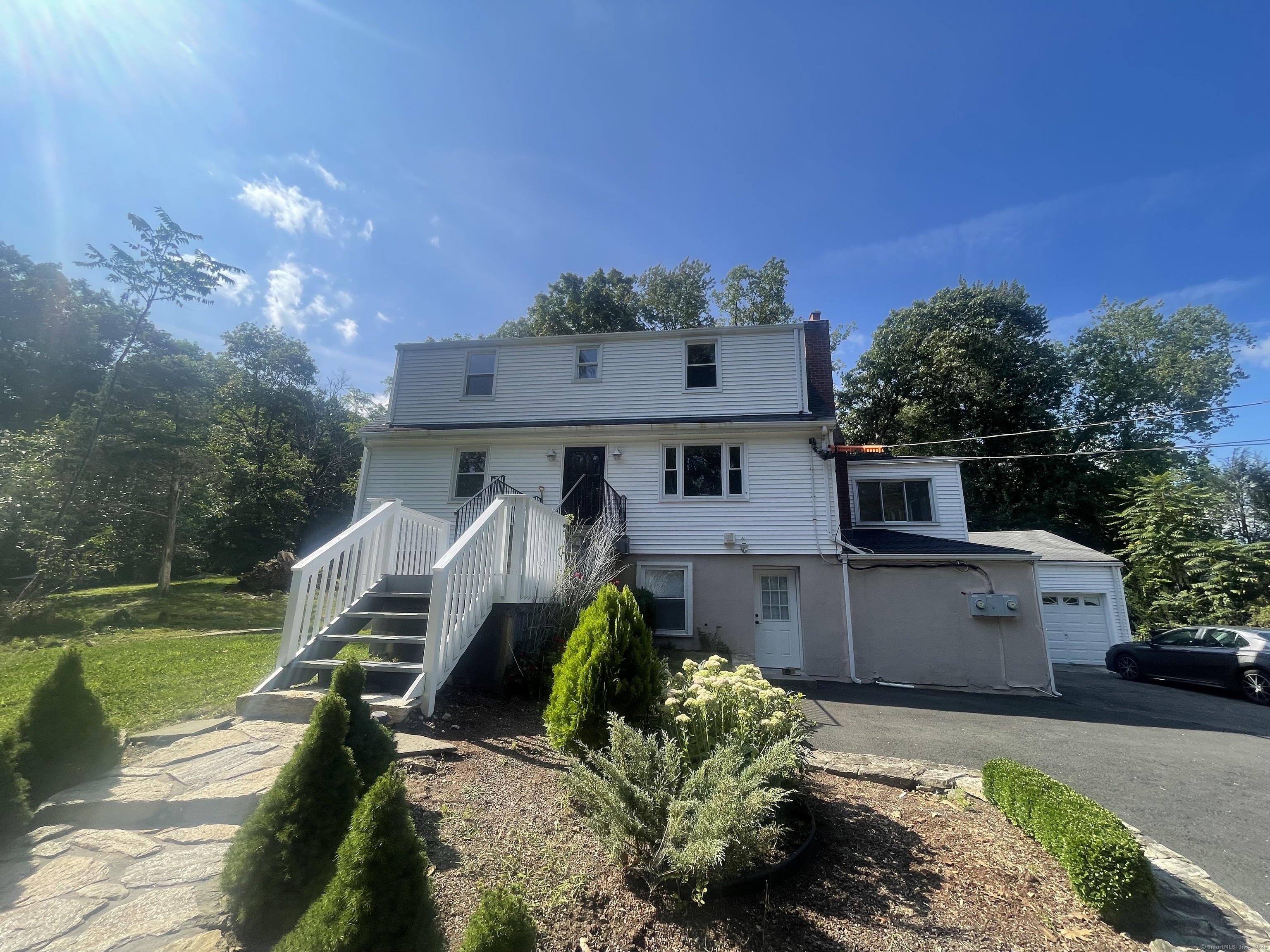 This beautifully renovated colonial home is situated in a highly desirable and convenient location. It combines modern updates with a spacious layout, making it an exceptional choice for your next home. The property features four well-appointed bedrooms, an impressive large eat-in kitchen, a cozy living room complete with a fireplace, an office space for productivity, and a stunning dining room that opens into a sunroom. Two fully renovated bathrooms and hardwood floors throughout add to the appeal. You'll also benefit from in-unit laundry facilities. The landlord takes care of heat, water, grounds maintenance, and trash removal, making your living experience hassle-free. Enjoy the privacy of a yard set back from the road, providing a peaceful retreat. Don't miss your chance to make this remarkable home yours!