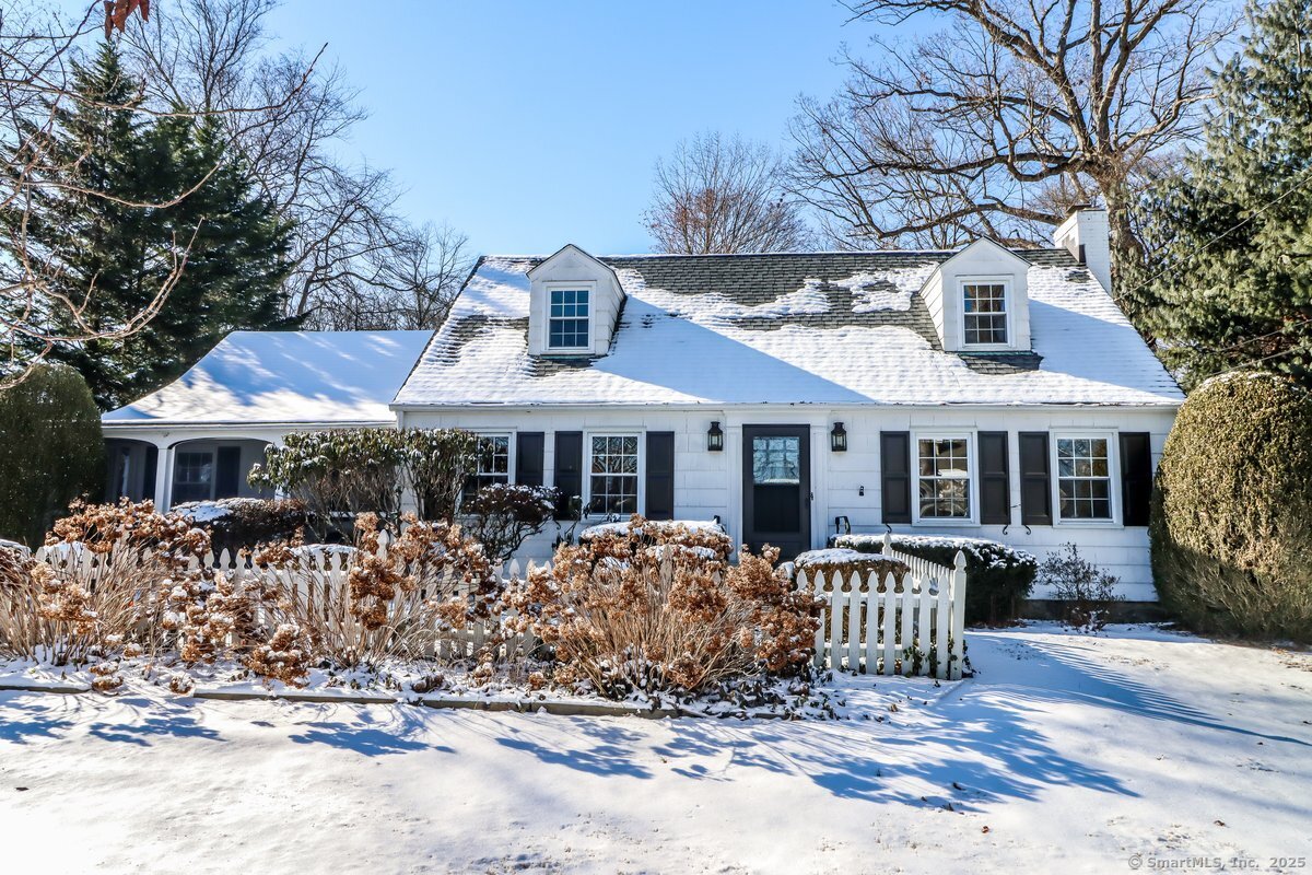 Welcome to 24 Orchard Lane. Nestled at the end of a quiet cul-de-sac in one of New Canaan's most sought-after neighborhoods, this charming 1939 Cape Cod-style home provides the perfect blend of character, comfort, and modern convenience. Set on 0.49 acres of thoughtfully landscaped grounds, the property is adorned with mature plantings that burst with color throughout the seasons, creating a picturesque and inviting setting. The home has been beautifully expanded to include a spacious open-concept family room and kitchen, an ideal gathering space. The second floor showcases a generously sized primary bedroom with soaring ceilings, abundant closet space, and a serene fireplace that serves as the focal point, adding a touch of luxury to your private oasis. Additional highlights include a welcoming front screened-in porch, a two-car garage, and a large backyard with a pergola & patio which is perfect for outdoor entertaining or relaxing in a very peaceful setting. Don't miss this extraordinary opportunity to own a home that combines timeless charm with thoughtful updates in one of the most desirable locations. Homes like this - brimming with character and potential to customize to your personal style - rarely come on the market. This is truly a special find!