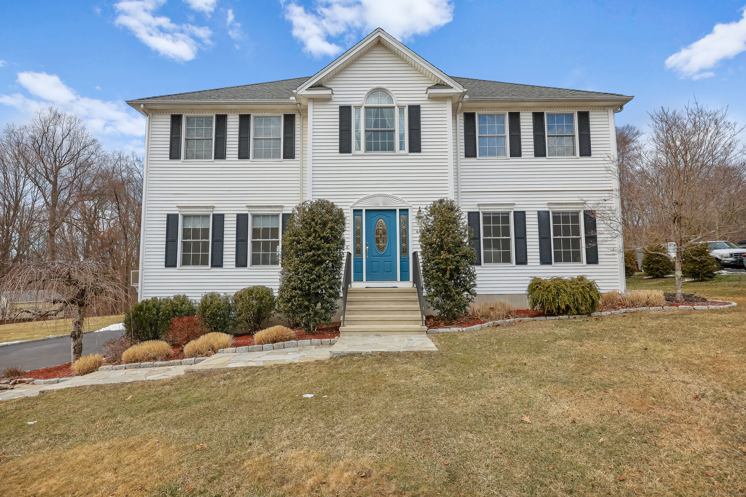 Welcome to your dream home located at 46 Cedarwood Lane! Nestled in a desirable neighborhood of Huntington, this beautiful 9-room Colonial home offers the perfect blend of luxury and comfort. Step inside to discover an oversized eat-in kitchen, complete with a large island that seamlessly flows into the expansive family room, highlighted by a stunning floor-to-ceiling stone fireplace. The main level also boasts spacious living room, dining room and dedicated office space, perfect for remote work or study. Upstairs you'll find three additional bedrooms, a convenient laundry area, and a full bath, ensuring ample space for family and guests. The primary suite is a true retreat offering privacy and luxury. The lower level features a full bath and a welcoming foyer with a walk out to your backyard oasis. Enjoy Summer days by the in-ground pool-perfect for entertaining or relaxing. Don't miss the opportunity to make this stunning property your own!