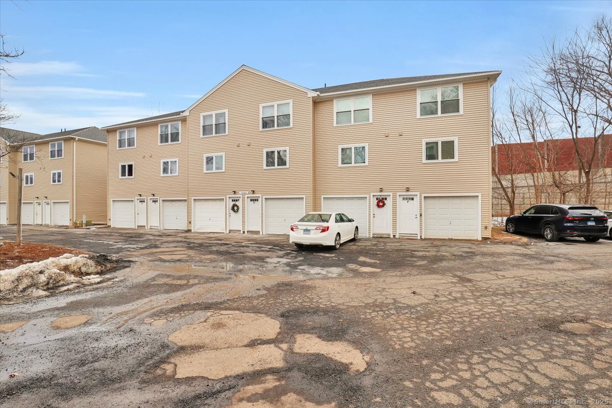 This beautifully updated, end-unit townhouse is ready for you to enjoy-just unpack and make it your own! Featuring an open floor plan and an updated kitchen including granite countertops, stainless steel appliances, and new cabinets. Step outside through the brand-new sliding door to your brand new trex deck with vinyl railings, perfect for relaxing or enjoying your morning coffee. On the upper level, you'll find two spacious bedrooms and a remodeled full bathroom. The property also offers brand-new vinyl siding, a new roof, and new windows throughout, giving you peace of mind for years to come. Enjoy the added convenience of an attached garage plus extra storage space in the laundry room. Whether you're a first-time homebuyer or looking to downsize, this townhome condo offers the perfect mix of comfort, style, and practicality. Don't miss out on making this your new home!