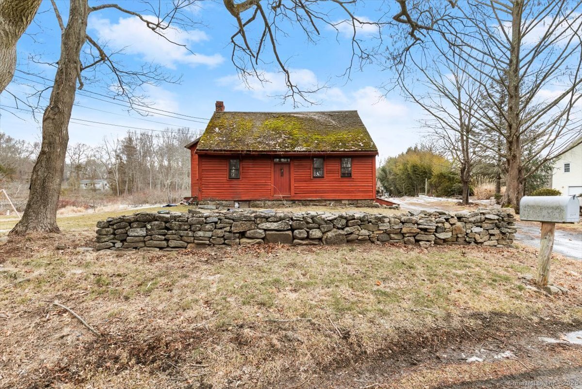 This unique 2.6-acre property offers a blend of historic charm and renovation potential. The centerpiece is a historical home that has been fully gutted, presenting a blank canvas for a complete rehab tailored to your vision. A spacious oversized barn with a finished dormer provides additional possibilities, whether for storage, a workshop, or future conversion. Additionally, the property features an accessory dwelling unit with one bedroom, offering immediate living space or rental potential. While the property requires a septic system and well, approved plans are available for both the main home and septic installation. This is a rare opportunity to restore and customize a historic home while enjoying the expansive acreage and versatile structures. Being sold As Is, Where Is. Buyers and agents to conduct their own due diligence.