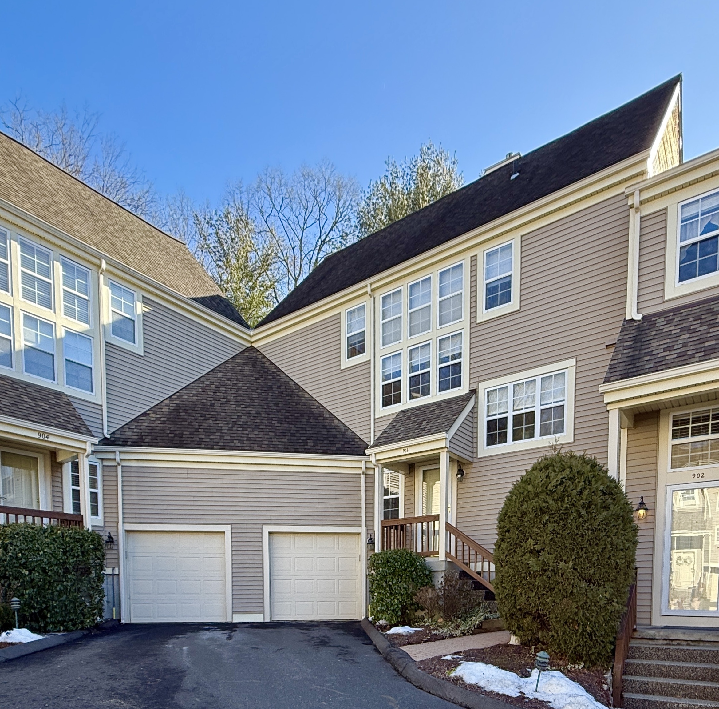 Welcome to the sought-after Foxboro complex! This stunning 1, 647 sq.ft townhouse greets you with a grand staircase and sun-drenched rooms. The attention to detail is evident throughout, from the oak, hardwood floors to the recessed lighting, fixtures and hardware. The open yet defined main floor offers a living room with slider to a private deck and serene setting, a sitting area that makes a perfect office or playroom, a formal dining room, half-bath and an updated kitchen. Granite countertops, stainless steel appliances, and Thomasville cabinets are complimented by tiled backsplash, a pass-thru window to the dining area plus room for a seating area. Closet space is abundant! The staircase leading to the second floor has a vaulted ceiling and high windows. The main bedroom has two, walk-in closets with built in drawers and shelving, a vaulted ceiling with fan and an updated and retiled bathroom with double sinks, a heated, jet tub, separate shower and its own stacked washer and dryer! The second bedroom is spacious with two closets, ceiling fan, its own bathroom with a deep tub and new tile. The basement offers a workshop area, open space for storage or a home gym, a laundry room with shelving and large closet. The single car garage is accessible from the basement and provides an insulated garage door. The complex provides plenty of parking, a pool and pool house, expansive grounds for walking and is convenient to shopping, I-95 and the Merritt Parkway. Gorgeous!