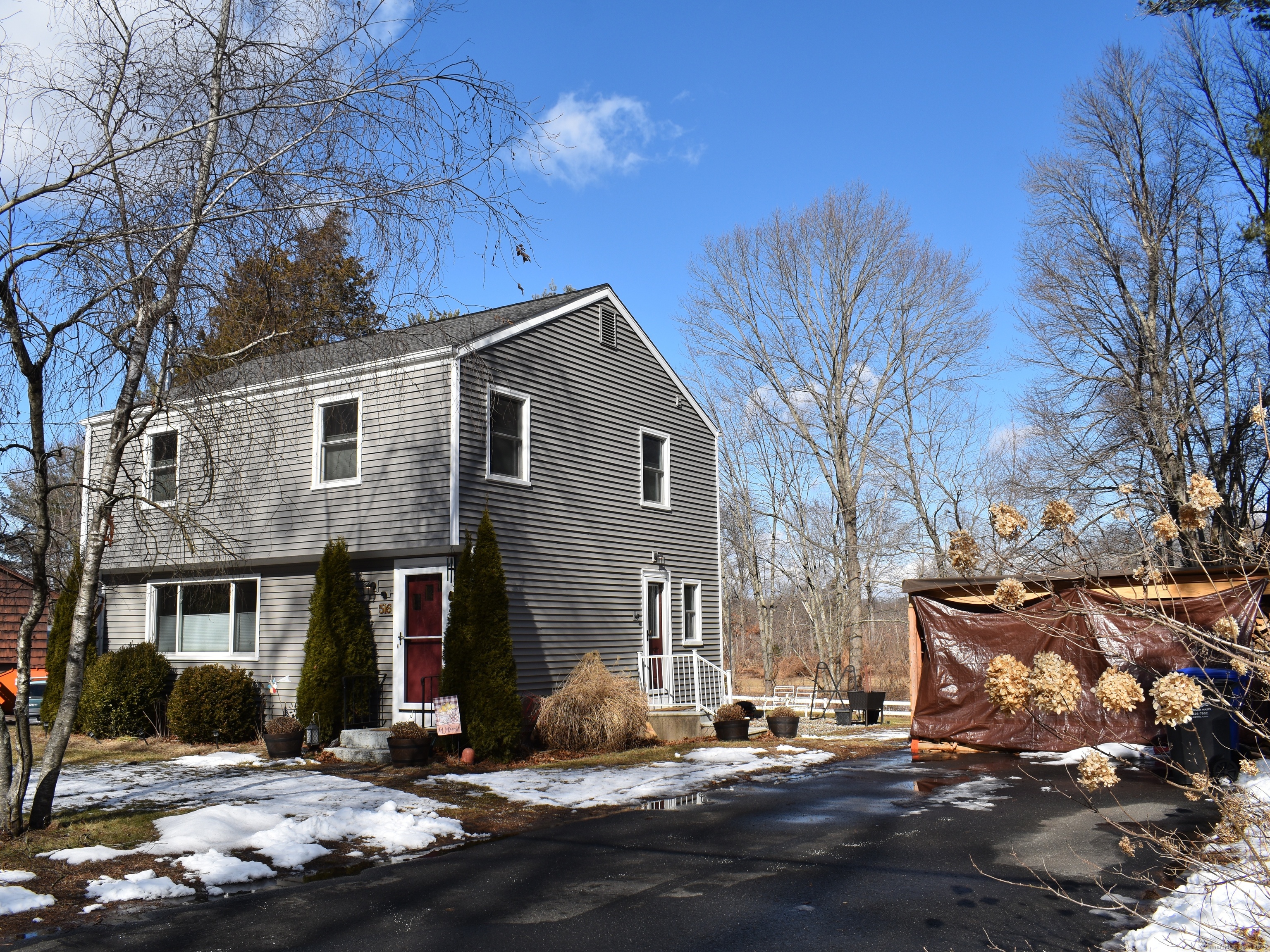 Welcome to 516 Strong Rd, South Windsor! This well-maintained home has been lovingly updated over the years. The first floor features a spacious, light-filled living room with hardwood flooring, and a charming dining room between the living room and kitchen. The large kitchen boasts soft-close drawers, ample cabinetry, a new sink, a propane stove, and a stainless-steel dishwasher. Large windows overlook the backyard and fenced pasture. An updated half bath is conveniently located by the side entrance. Upstairs, you'll find three sizable bedrooms with hardwood floors and ceiling fans, along with an updated full bath. There's also a smaller fourth bedroom, currently used as a closet, but ideal for a nursery, home office, or additional storage. The rear of the home offers peaceful views of a fenced pasture, while the front frames a picturesque forest. Recent updates include a new HVAC system (2021), roof replacement (2022), new siding (2022), wood stove (2022), oil tank (2023), and all new windows (2023). With these major upgrades already completed, this home is move-in ready!