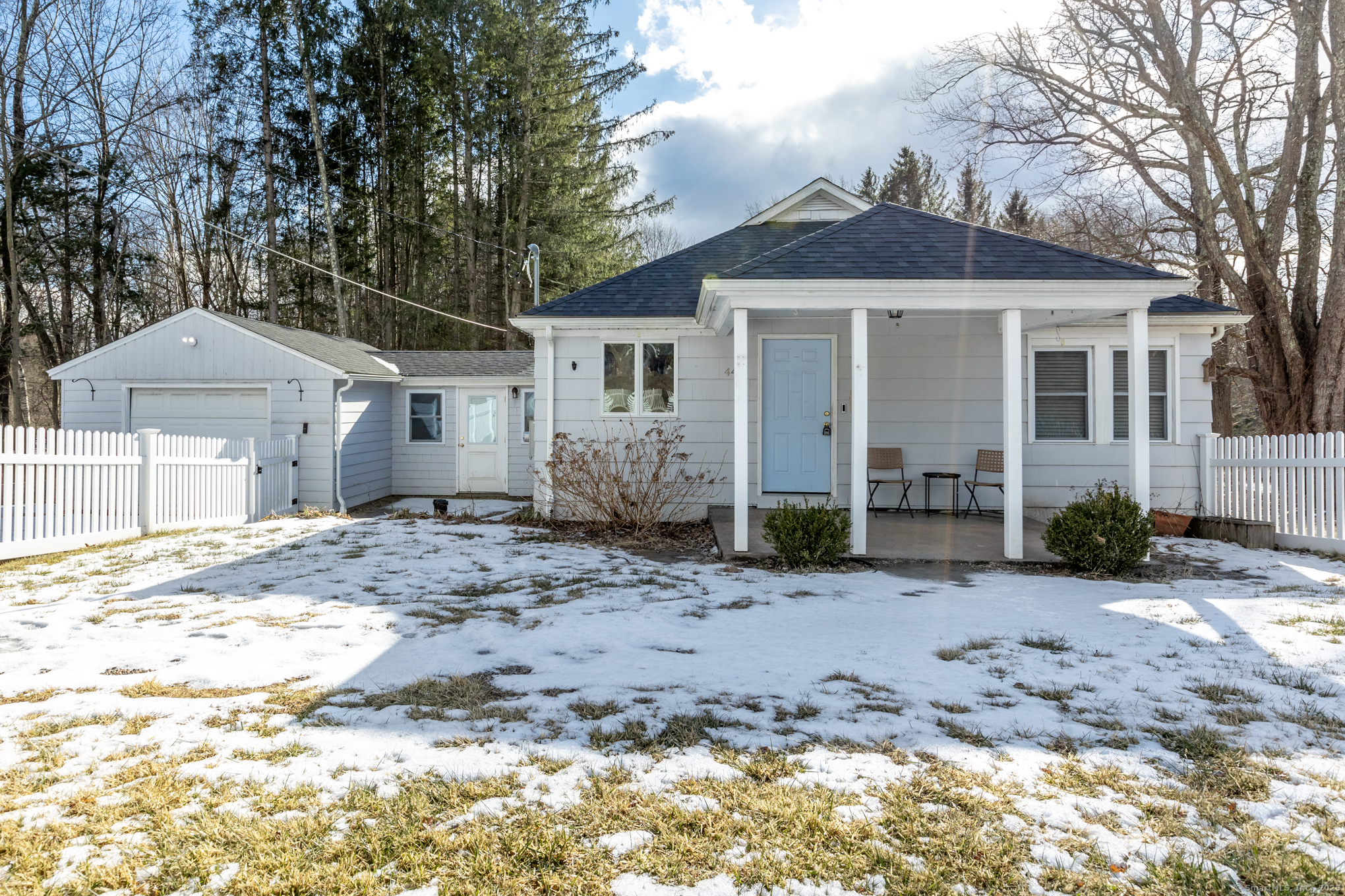 This charming 3-bedroom, 2-bath ranch-style home is nestled on a picturesque 3-acre lot, offering the perfect blend of comfort, privacy, and fenced-in space. Beautiful hardwood flooring flows throughout the main level, enhancing the warm and inviting atmosphere. The kitchen is a true highlight, featuring a skylight that fills the space with natural light, ample countertops, stainless steel appliance and built-in storage. The spacious living room seamlessly connects to the kitchen and provides access to both the front entrance and a welcoming front porch. A quaint breezeway off the kitchen leads to the attached one-car garage and offers additional access to the fully finished walkout basement. This incredible lower-level living space includes two extra bedrooms, a full kitchen, and a cozy living room with a wood-burning fireplace-ideal for guests or possible in-law. Full interior was just painted! House is set back from the road which offers a serene and private setting with endless possibilities. Don't miss your chance to own this beautiful retreat! Professional photo's coming soon!