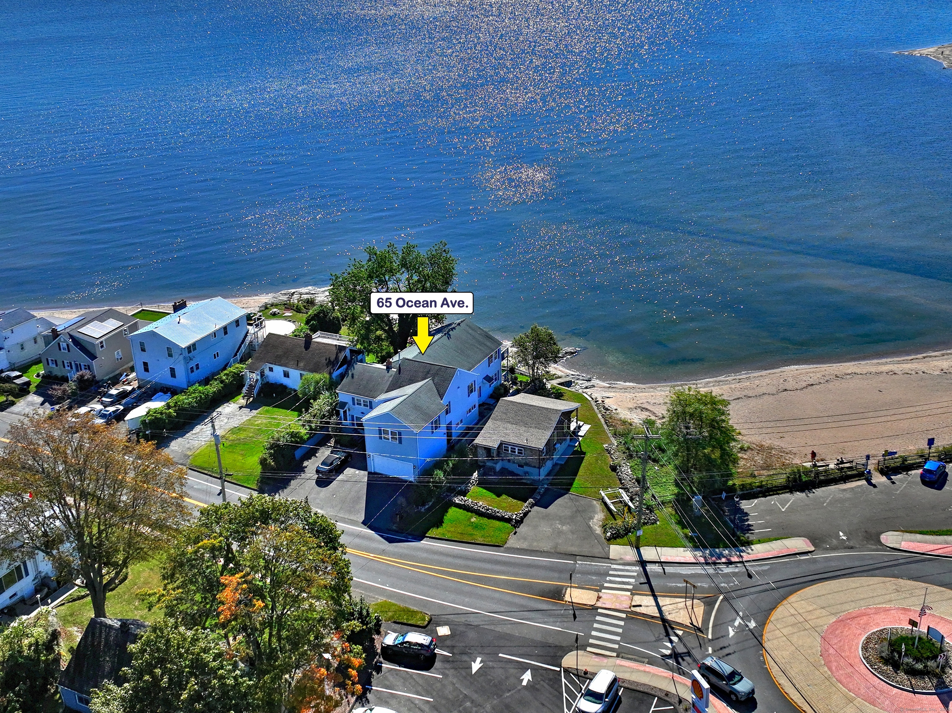 An extraordinary opportunity to own a breathtaking waterfront multi-family property in the coveted West Shore area of West Haven. This stunning home offers panoramic ocean views and is ideal for investors or those seeking a unique living experience by the shore. Unit 1 is a spacious two-level residence featuring 4 bedrooms and 2.5 baths. Boasting incredible ocean views from the large windows, hardwood floors, and a gourmet kitchen with Miele professional-grade appliances, including a gas cooktop, double ovens, and a built-in coffee machine. The floor plan includes a large living room with balcony and a billiard room with sliders to walk out to the water. The unit is equipped with central air and natural gas heat. Unit 2 is a ground-level apartment with hardwood floors, a family room, kitchen with granite countertops, and a large bedroom with ocean views. Electric heat provides comfort year-round. Unit 3 is a cozy one-bedroom unit, also ground level, offering electric heat and privacy behind the garage. The property includes a 2-car garage, ample parking with a newly paved driveway, and is just minutes from major highways, making commuting a breeze. Don't miss this rare opportunity to own a waterfront property with exceptional income potential and unbeatable views! The property will be delivered vacant at closing.