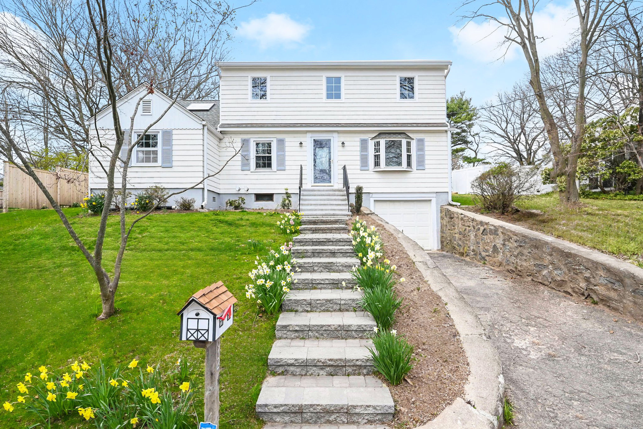 Discover urban coastal lifestyle in this fully renovated Fairfield Cape Cod home, located on a quiet, tree-lined street. Just a stone's throw from Fairfield's vibrant downtown and stunning beaches, this home presents the perfect opportunity to embrace a quintessential coastal lifestyle while still enjoying the conveniences of downtown living. Upon entering, you'll find a spacious living room featuring bay windows and a cozy wood-burning fireplace. The large dining room has ample space for entertaining. The large, sunny kitchen boasts custom cabinetry, stainless steel appliances, and plenty of storage. Enjoy your morning coffee in the sunroom, which boasts picturesque views of the private, fully fenced backyard. The sunroom, surrounded by large windows on three sides, opens directly to the patio, seamlessly blending indoor and outdoor living. Completing the first floor is a bedroom with built-in shelving and a full bathroom featuring a glass-enclosed shower. The second floor provides two generously sized bedrooms and a full bathroom with a shower/tub combo and custom shelving. The third floor boasts a luxurious primary suite, complete with a spacious bedroom, a walk-in closet with a custom organization system, and a beautifully designed en-suite bathroom featuring dual vanities and a glass-enclosed shower. An additional office/flex room with built-in shelves and a skylight completes the top floor, providing a private and versatile space.