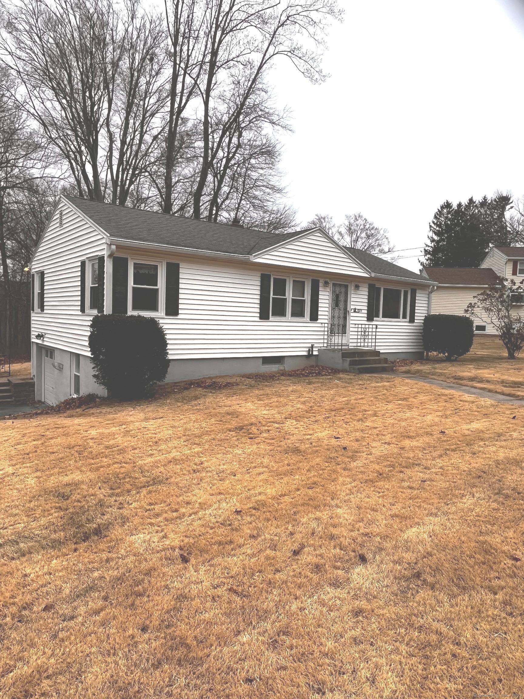 Ranch style home w vinyl siding, 3 bedroom, 1 bath, partially finished basement and under house garage. Central air, hardwood floors. Subject to probate court approval