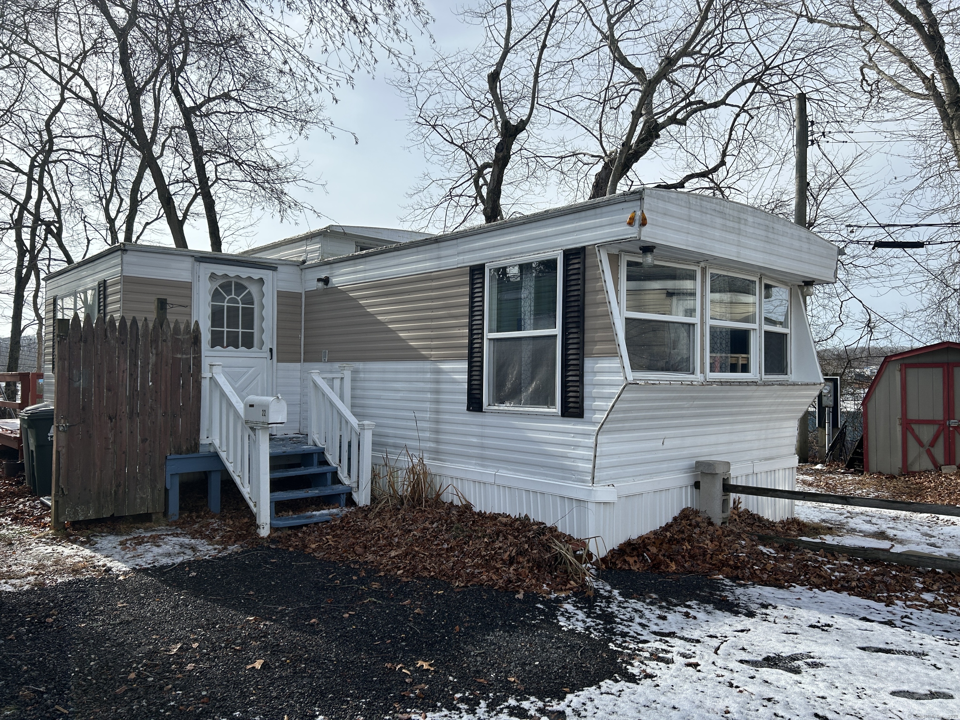 Mobile Home - Corner Lot with 2 bedrooms, 1 bath. Spacious living room with bay out window, eat-in kitchen with lots of cabinets and built-ins for plenty of storage. Primary bedroom is good size also has built-in. Recently painted and newer laminate flooring throughout. Nice deck off the side toward the back to enjoy grilling out or simply just enjoying a cup of coffee. You have your own storage shed in the back for any additional needed storage. Conveniently close to major employers, shopping and dining! This is an estate sale, probate court is complete and being sold as-is. Subject to mobile home park approval.