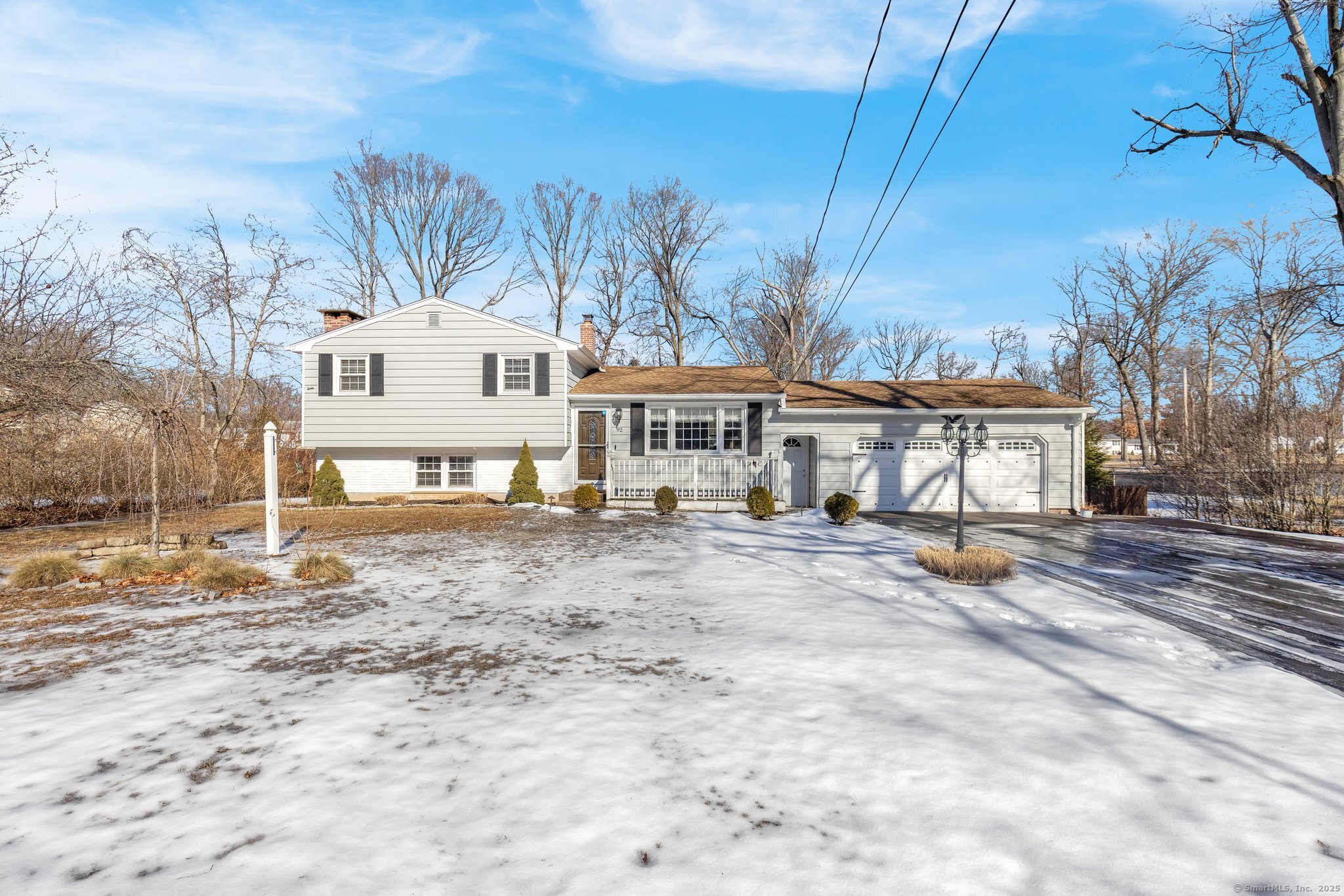 Welcome to this beautiful split-level in the heart of Wallingford! Nestled on nearly a half-acre, this wonderful home features plentiful updates and features! Upon entering, guest are greeted by a lovely living room with gleaming hardwood floors and large bright picture windows. An updated eat-in kitchen features new cabinetry, Stainless Steel appliances, breakfast bar and gorgeous granite countertops featuring DuPont-style edgework. Continue on to find a generous-sized lower level family with a wood burning fireplace and tile floors. The workout/rec room could be used as a third/fourth bedroom, workout room or home office with walk-out access to the backyard! A large half-bathroom with attached laundry room complete the lower-level space. Venture upstairs to find an updated full bathroom with tile floors, shower/tub, new vanity and lighting. Two large bedrooms reside, however the home was originally configured as a three bedroom; which could be easily converted back as all the doors and framing still retain accessibility! Other features include a new furnace(2025), central air conditioning, large rear deck, oversized two-car attached garage, and a sprawling back yard! This home is a commuters dream... just minutes to all major highways, shopping and entertainment! Welcome to your new home!