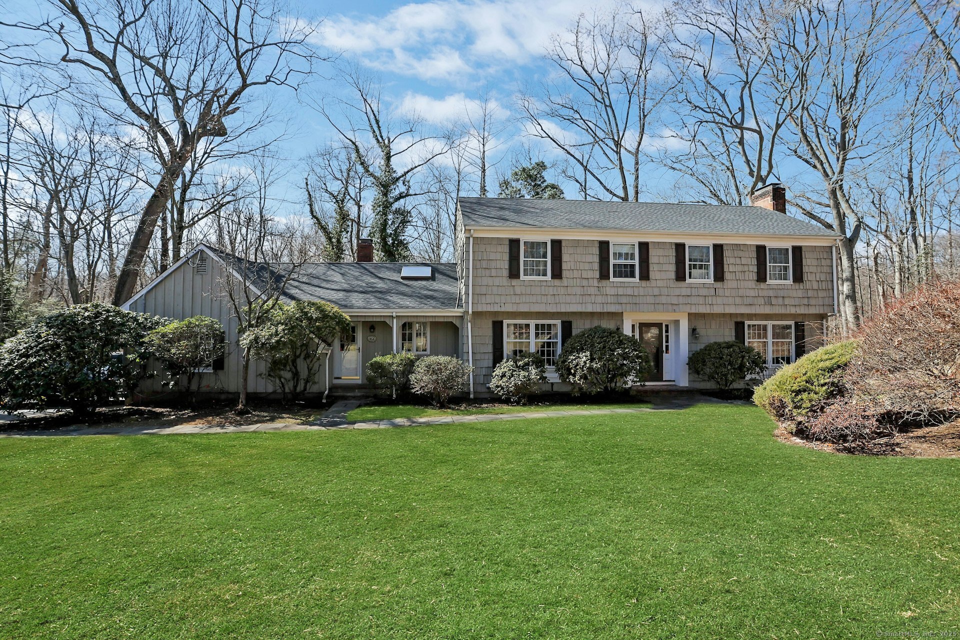 LOCATION LOCATION! Tremendous opportunity to move to a cul de sac within walking distance to schools, the train, Darien Commons and Woodland Park. This 4 bedroom, 3 bathroom home offers a large open living space with doors leading to deck ideal for entertaining. The kitchen includes an extra large dining area with built-in bar and a sun filled family room. Special features include 3 wood burning fireplaces and a full finished walk out basement with laundry room, full bath and potential extra bedroom. Lots of storage as well as a two car garage with a separate walk in entrance. This home offers wonderful space both indoors and out.