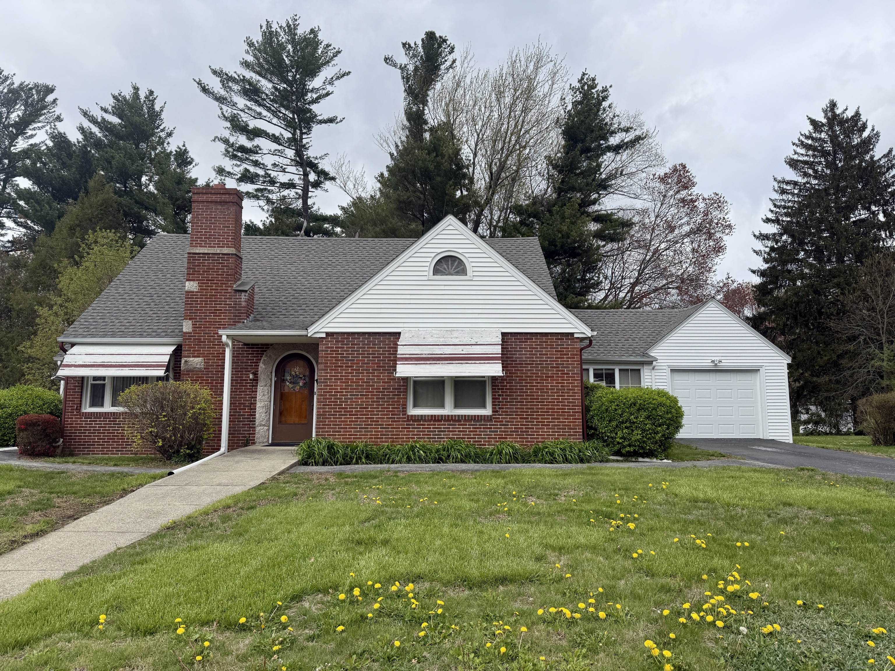 Who is looking for a home with an In-law? Look no further. For the 1st time ever, this charming Cape Cod home is on the market! This pristine, move in ready home was Built in 1951, has been lovingly maintained and still carries all the charm of its original era. In a prime location just 2 minutes from I-395, it sits on a quiet road across from Griswold Public Schools-offering both convenience and community. The main floor features a cozy living room, an eat-in kitchen leading to a bright sunroom, a formal dining room, a full bath, and a spacious bedroom. An extra room, perfect for a home office, provides direct access to the breezeway and garage. You'd never guess it from the outside, but upstairs offers a complete IN-LAW SUITE perfect for MULTIGENERATIONAL living with its own living room, a 2nd FULL KITCHEN, two bedrooms, and a full bath. Talk about having room for that holiday cooking!!! You could cook it all with 2 kitchens. Thoughtfully designed with oversized doorways, it was originally built for the seller's Uncle, a WWII veteran who returned home in a wheelchair. The one-car garage, with a new door in 2024, is great for parking or extra storage. The heated basement, once a hub for family gatherings, features all-new windows and even a vintage darkroom for photography enthusiasts. Sitting on a flat, manageable 0.52-acre lot, the home has city water and sewer, with natural gas available for future conversion. A new boiler & oil tank was installed in 2023.
